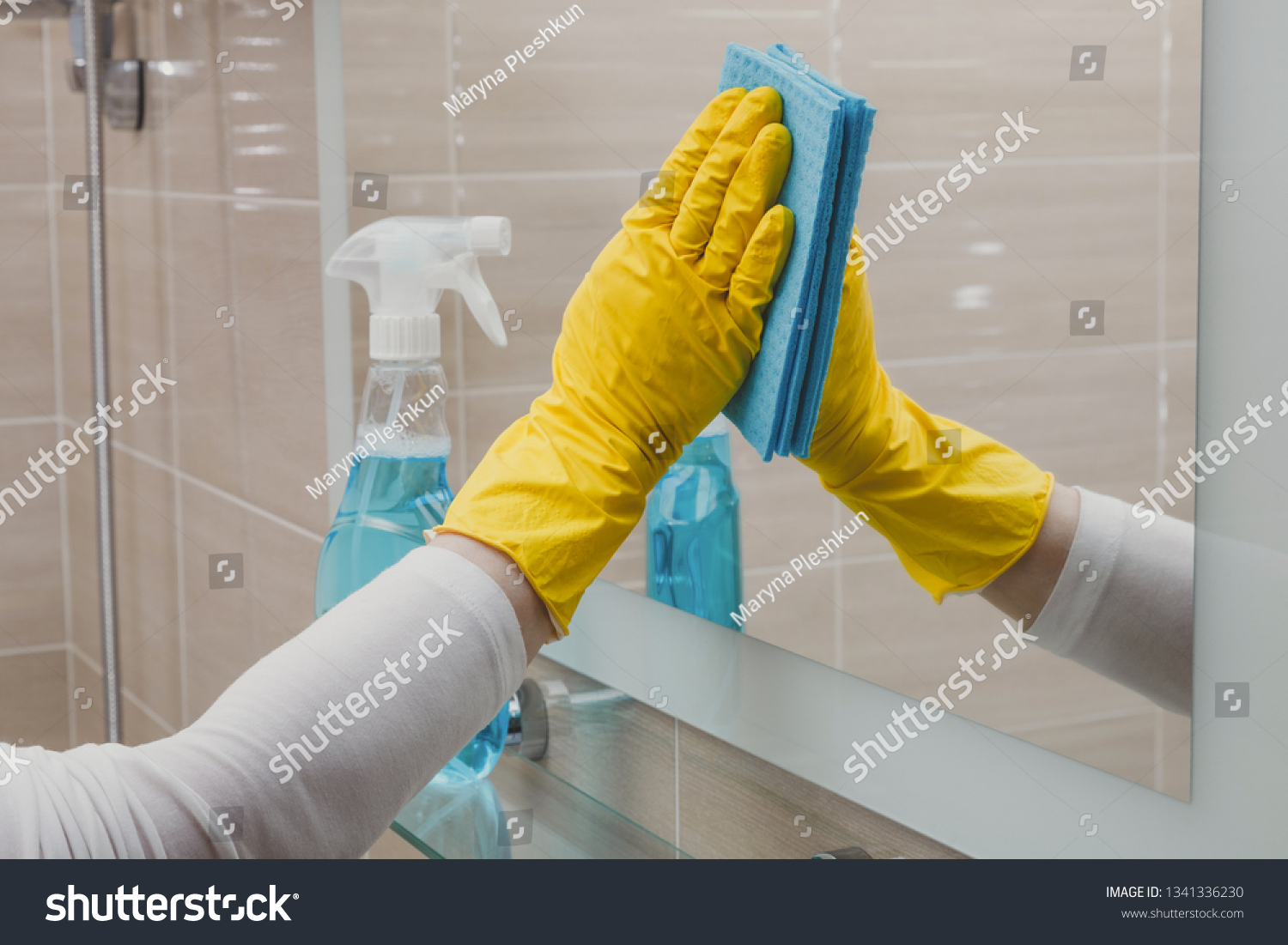 Housemaid cleaning a bathroom, closeup shot #1341336230