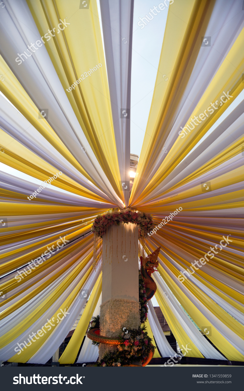 The fabric that is stretched is a large sun-shading tent. #1341559859