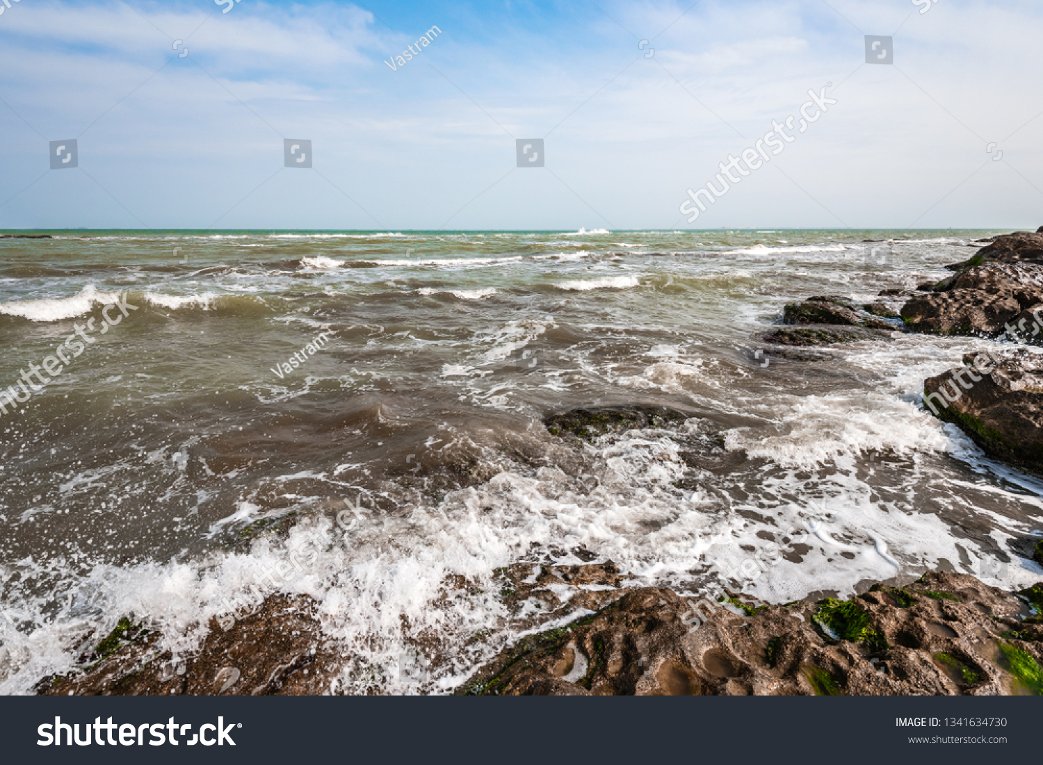  Splash of waves on a rocky seashore landscape #1341634730