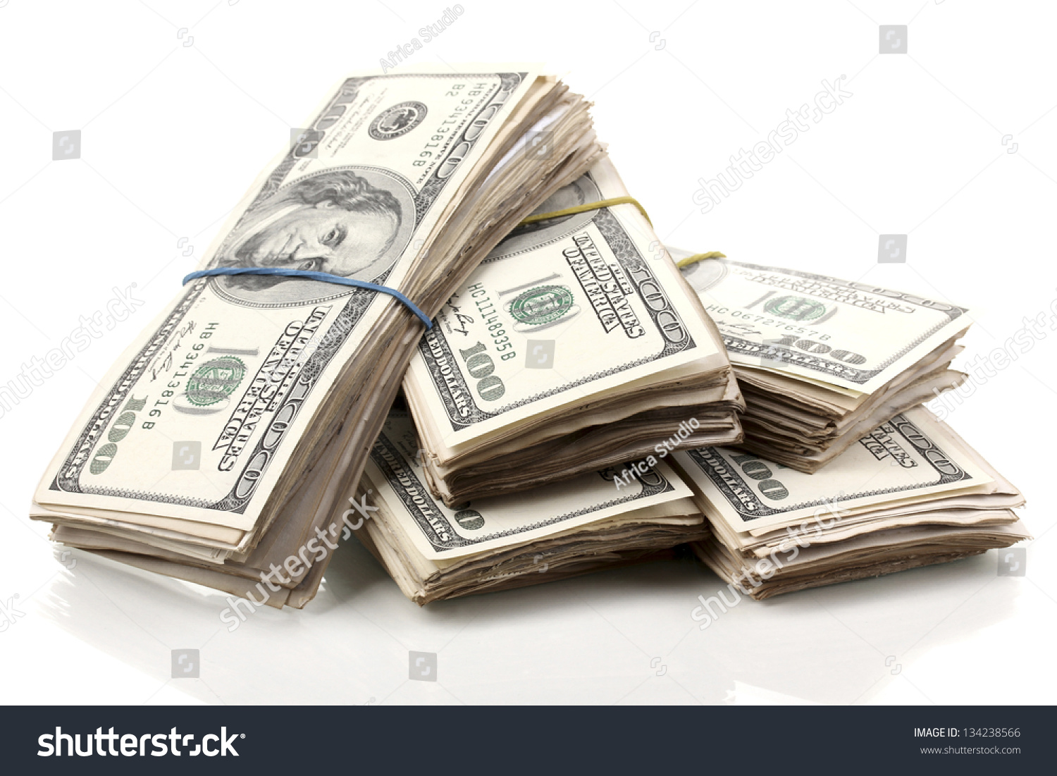Stacks of one hundred dollars banknotes close-up isolated on white #134238566