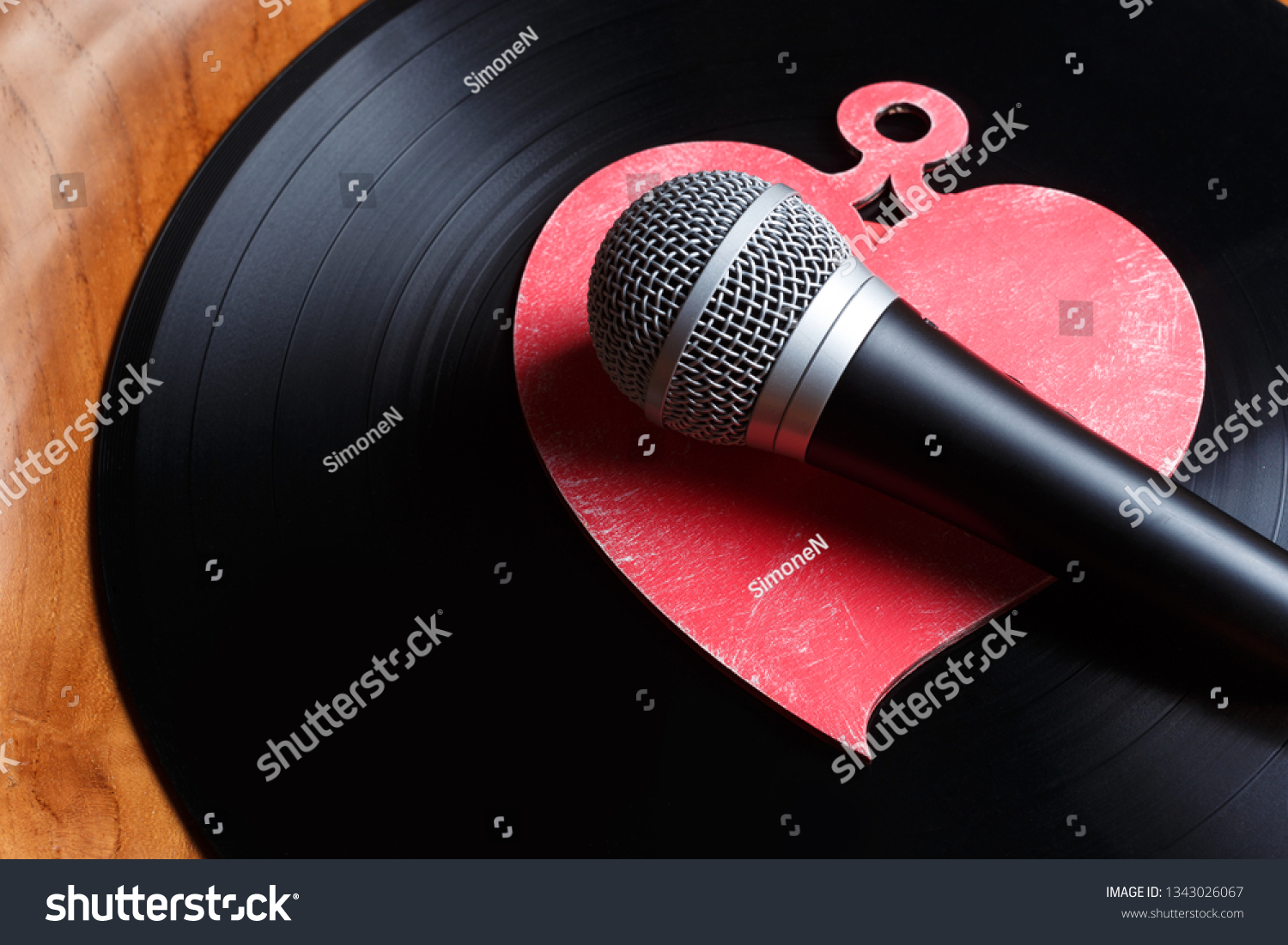 Song for lovers. Nostalgic songs, concept with vinyl records, microphone and heart #1343026067