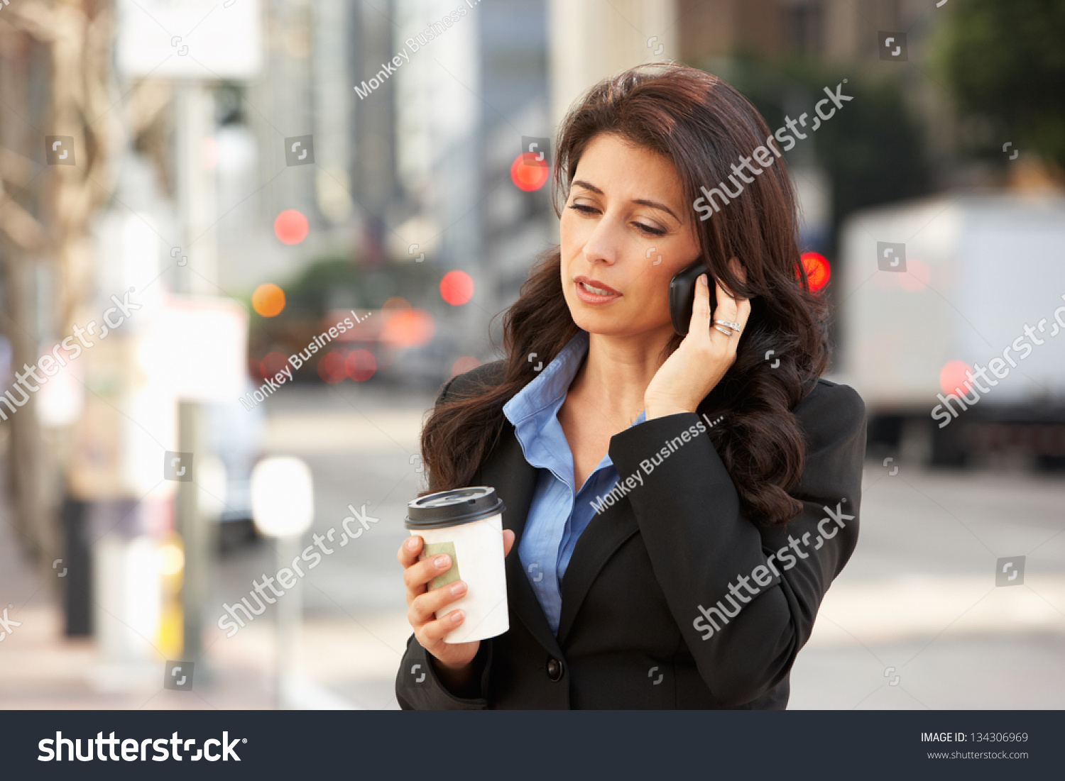 Businesswoman Outside Office On Mobile Phone #134306969