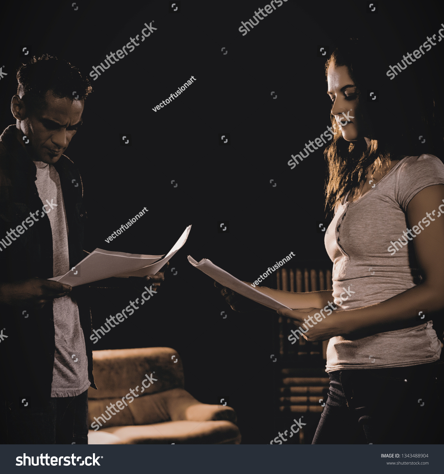 Actors reading their scripts on stage in theatre #1343488904