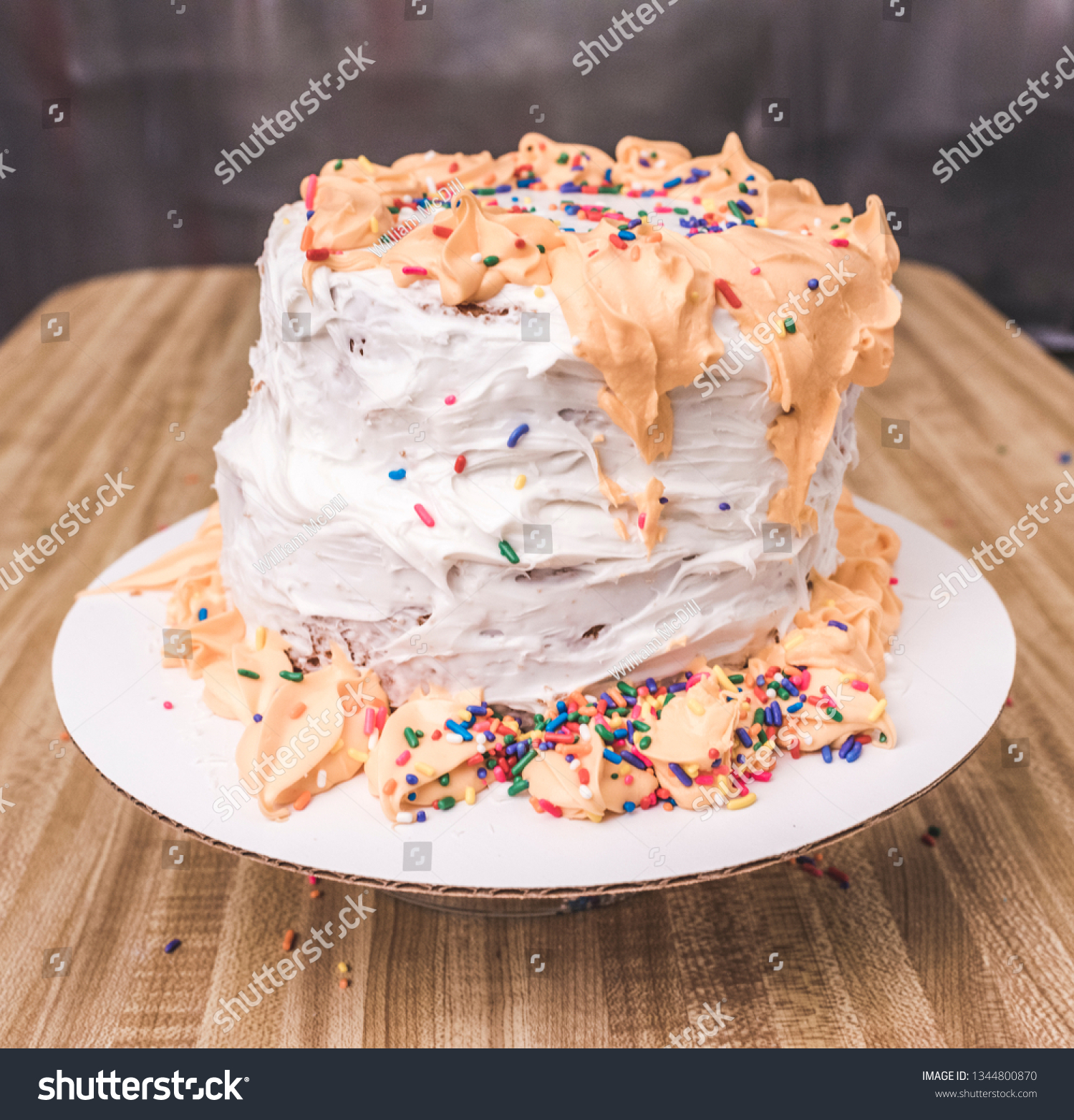 Nasty cake on a wooden table. #1344800870