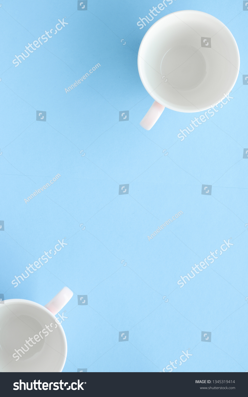 Kitchen, dishware and drinks concept - Empty cup and saucer on blue background, flatlay #1345319414