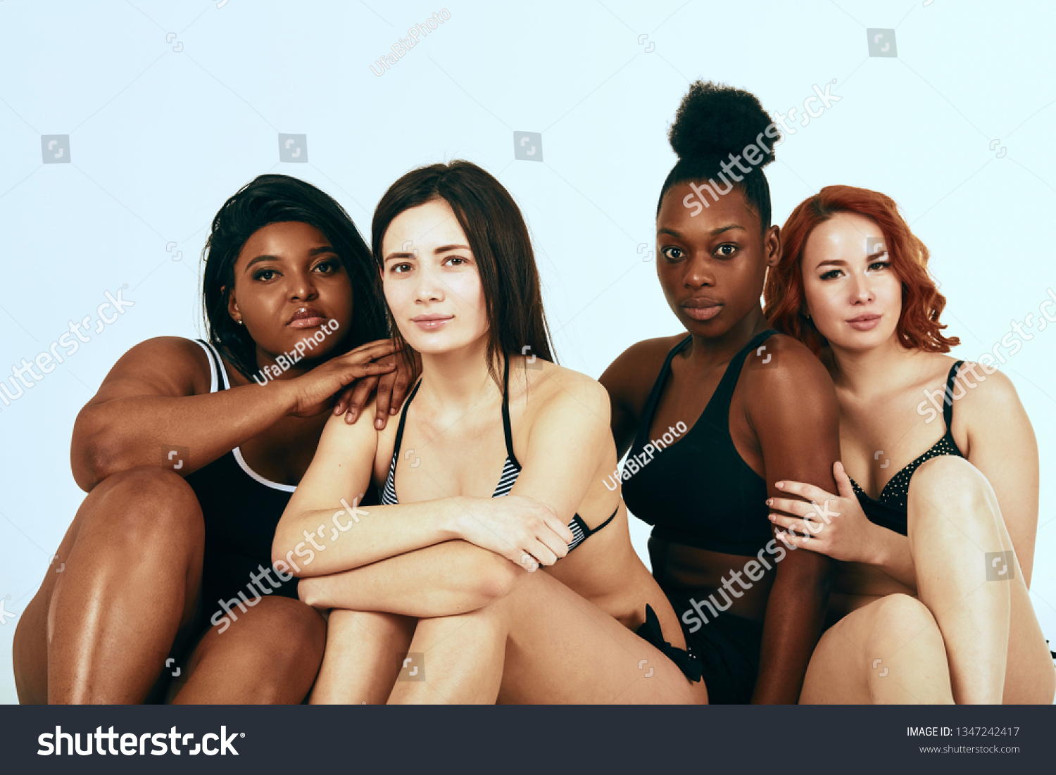 Multi-ethnic beauty. Different ethnicity women - Caucasian, African, Latin, Hispanic beautiful adult girlfriends posing in underwear isolated over white studio background. #1347242417