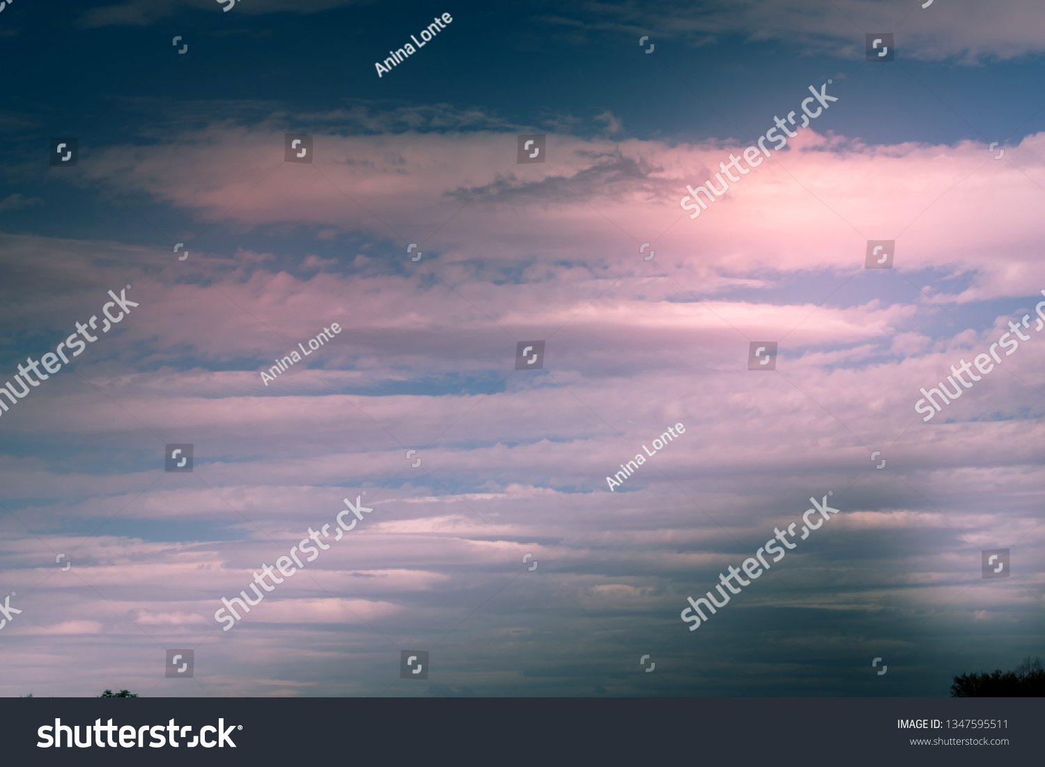 Soft, pinkish lenticular Clouds #1347595511