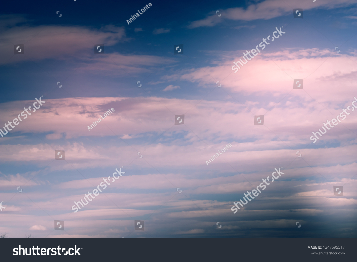 Soft, pinkish lenticular Clouds #1347595517