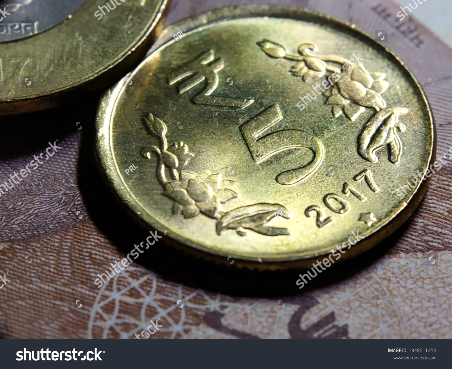 Indian five rupee coin close up shot #1348611254