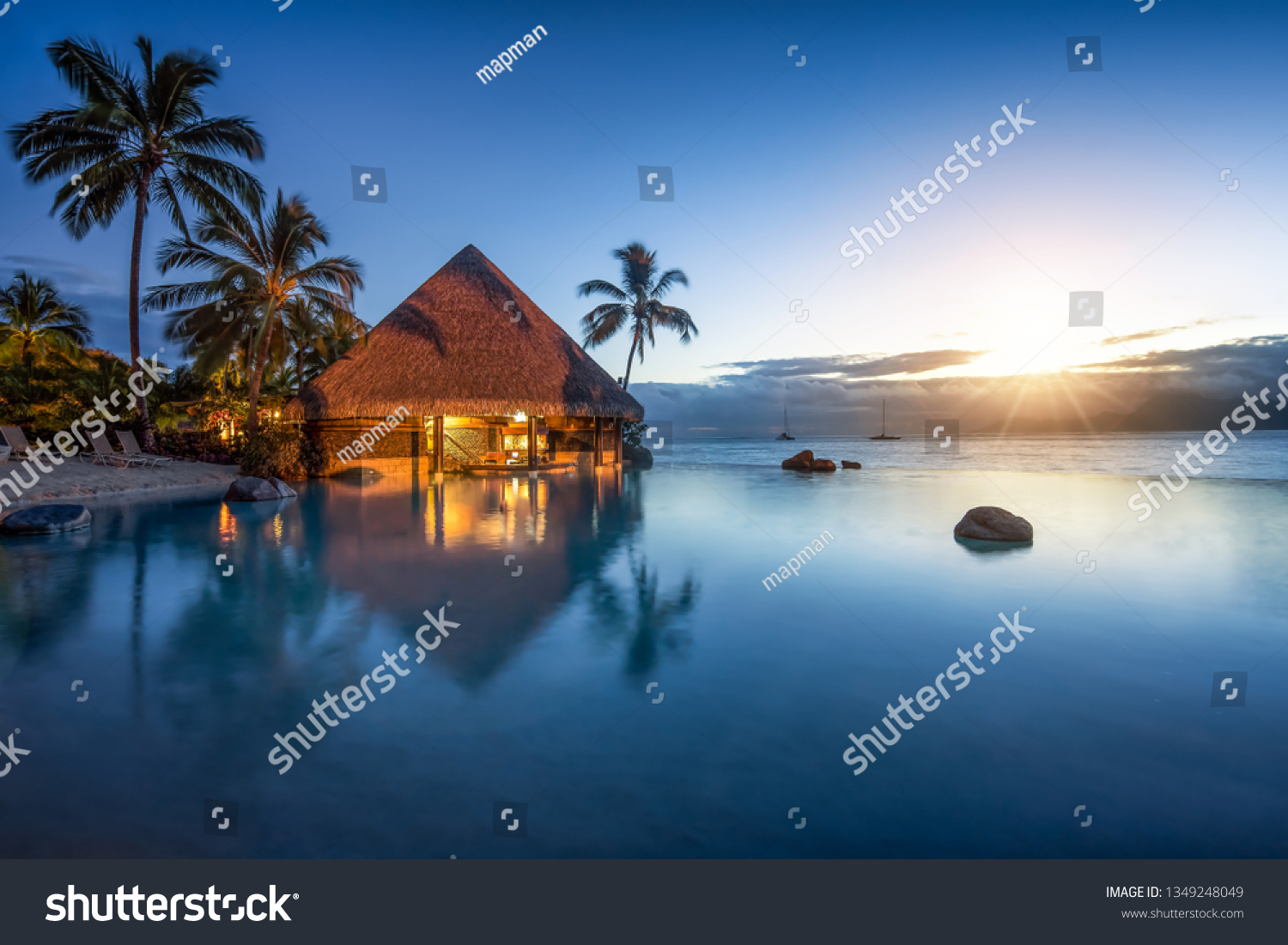 Romantic sunset at a luxury hotel with infinity pool #1349248049