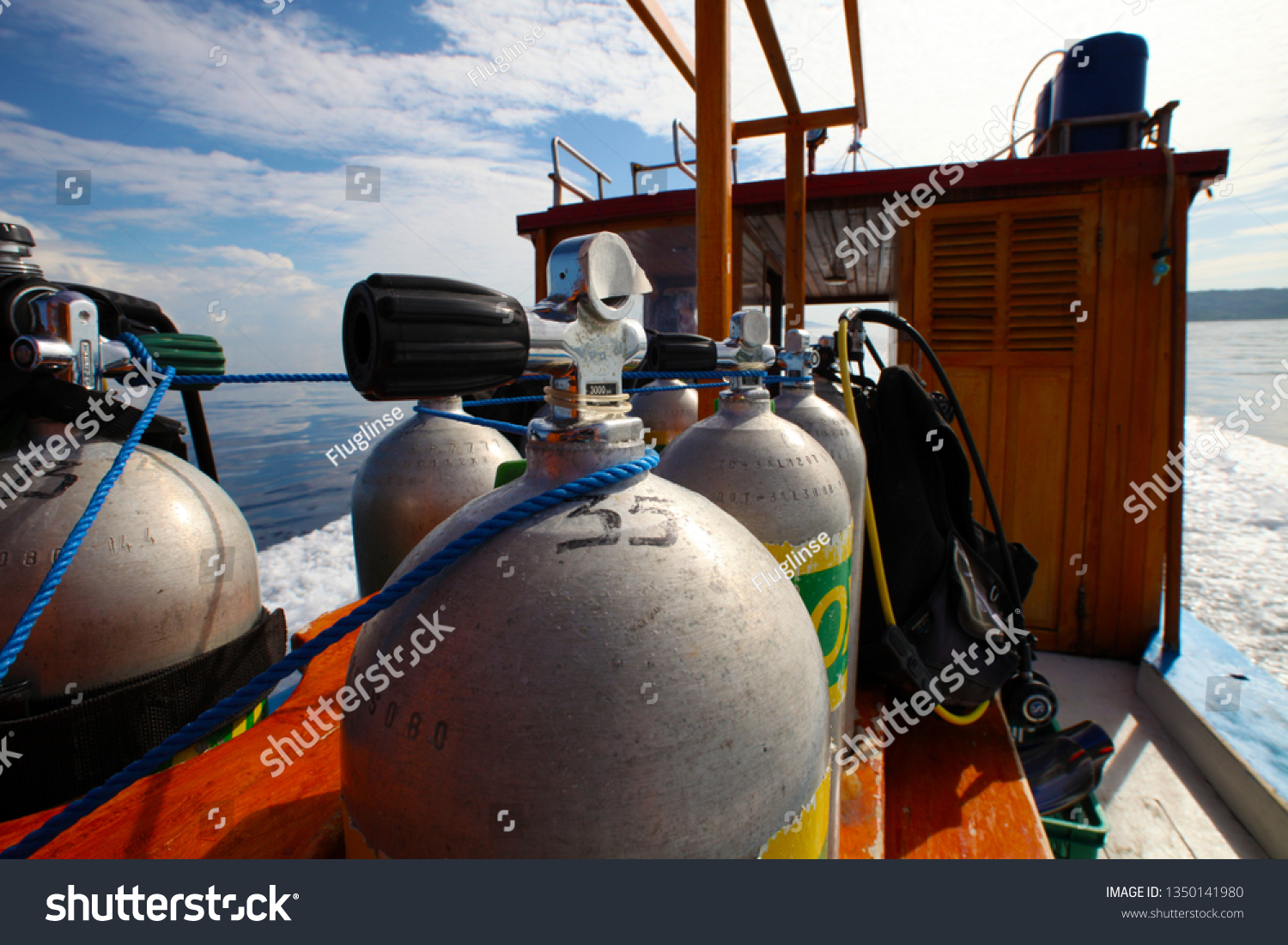oxygen tanks and diving equipment on diving boat #1350141980