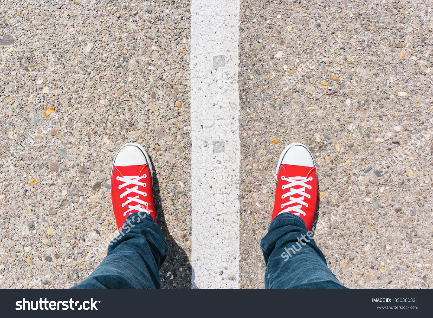 Man standing on grunge asphalt city street with white line on the floor, point of view perspective #1350380321