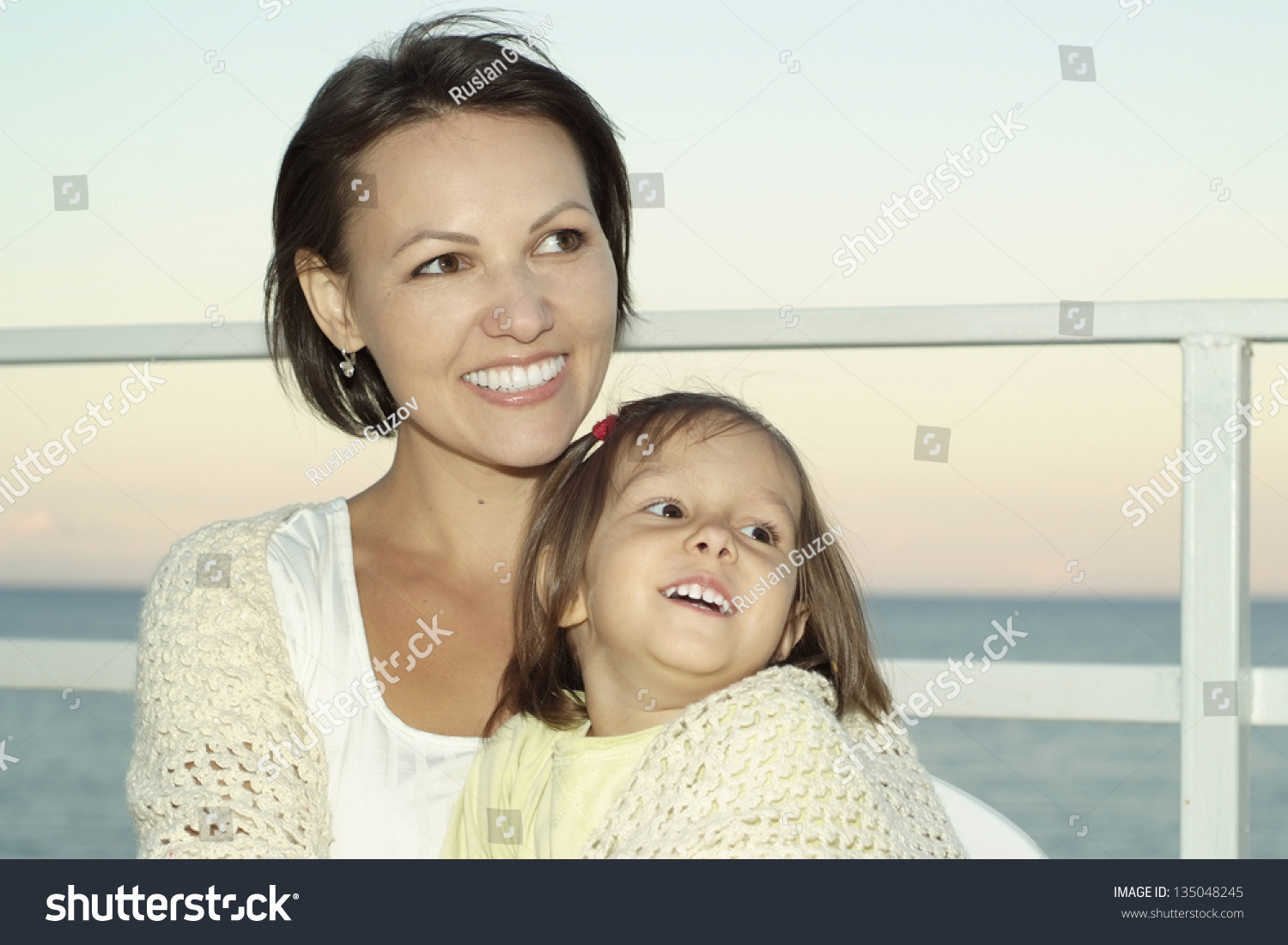 portrait of young happy woman with a young daughter on vacation #135048245