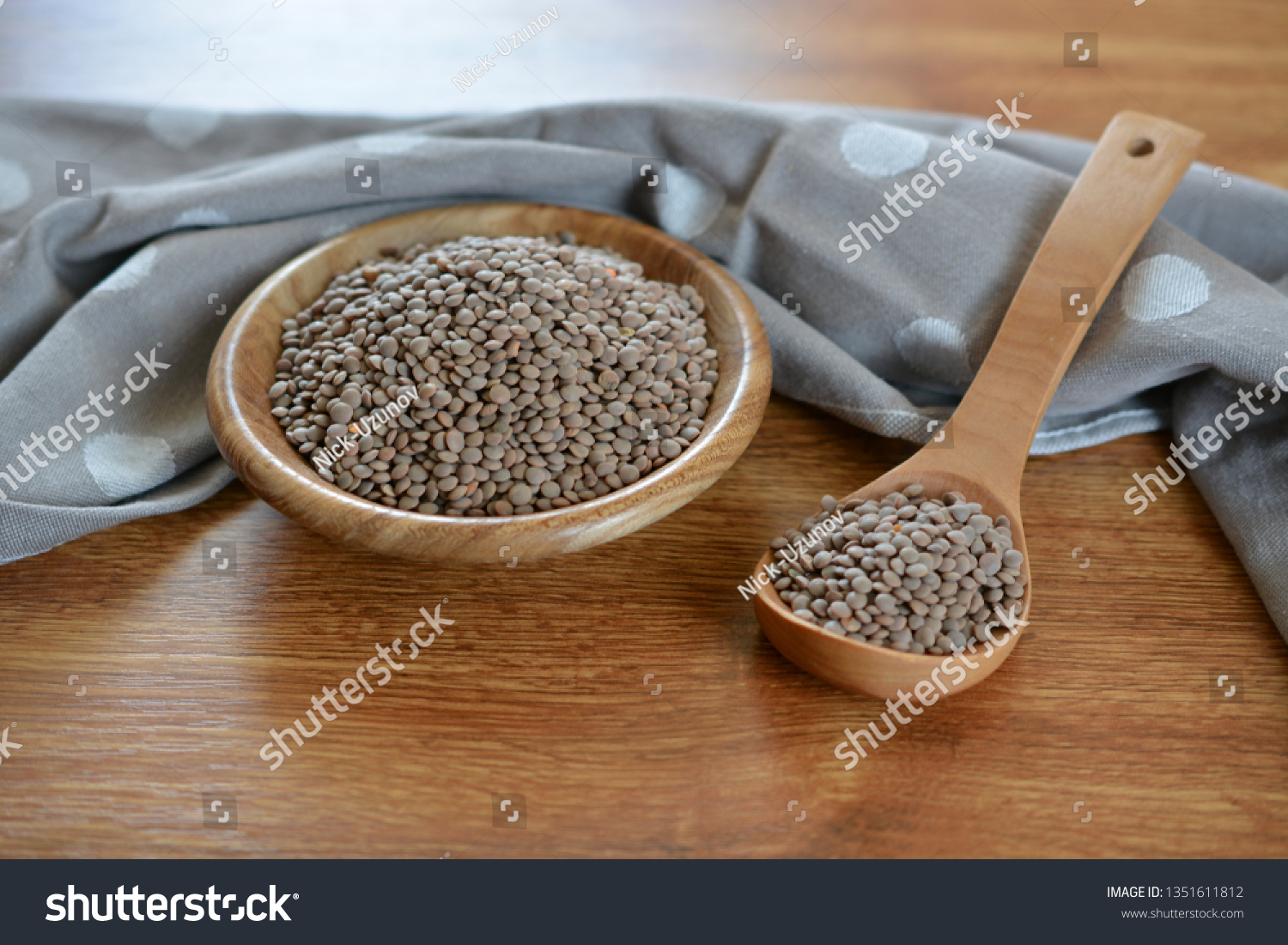 raw gray lentils in a bowl #1351611812