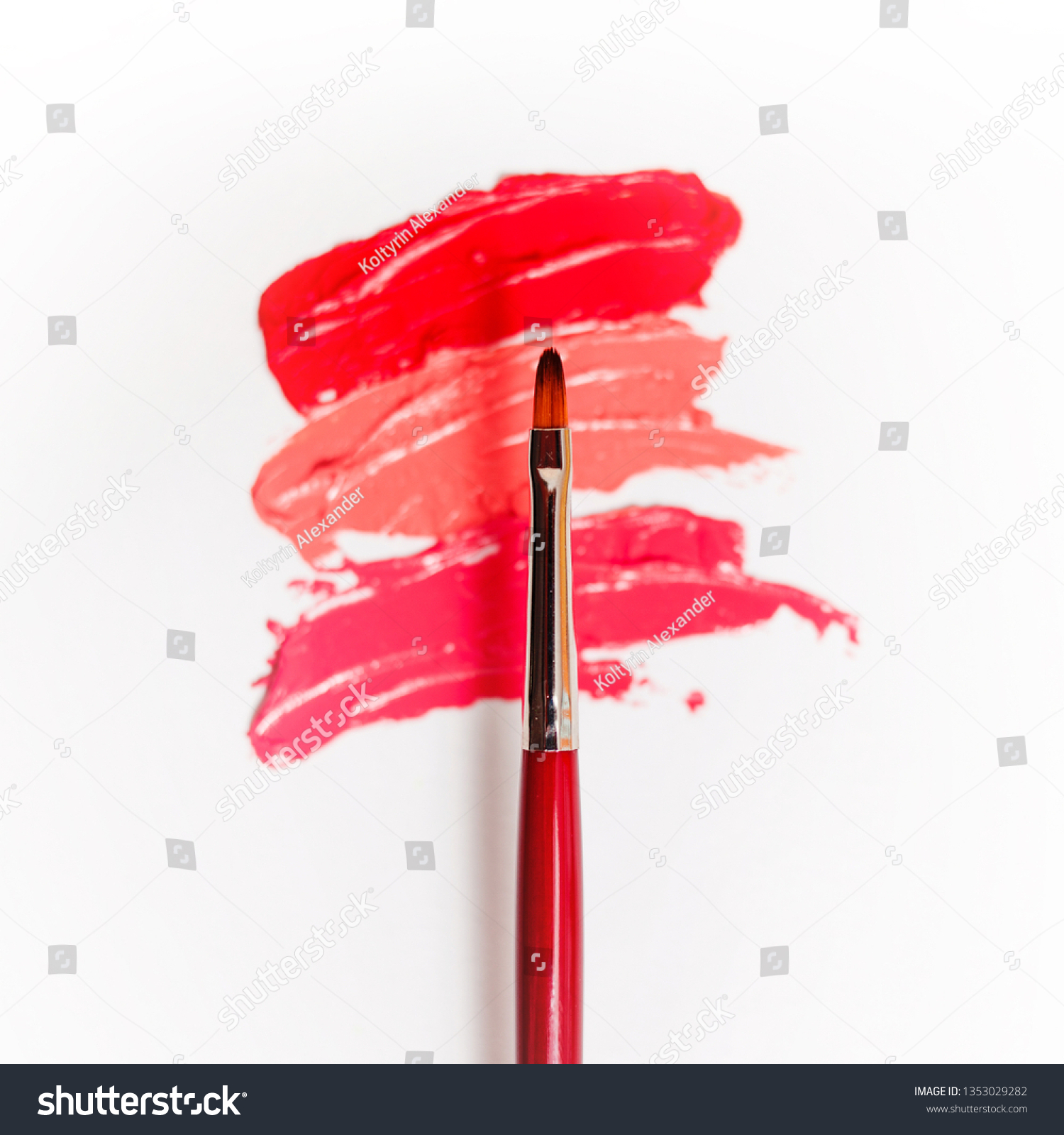 Lipstick and lip gloss, drops and strokes of different shades With brushes for application and shading, white background #1353029282