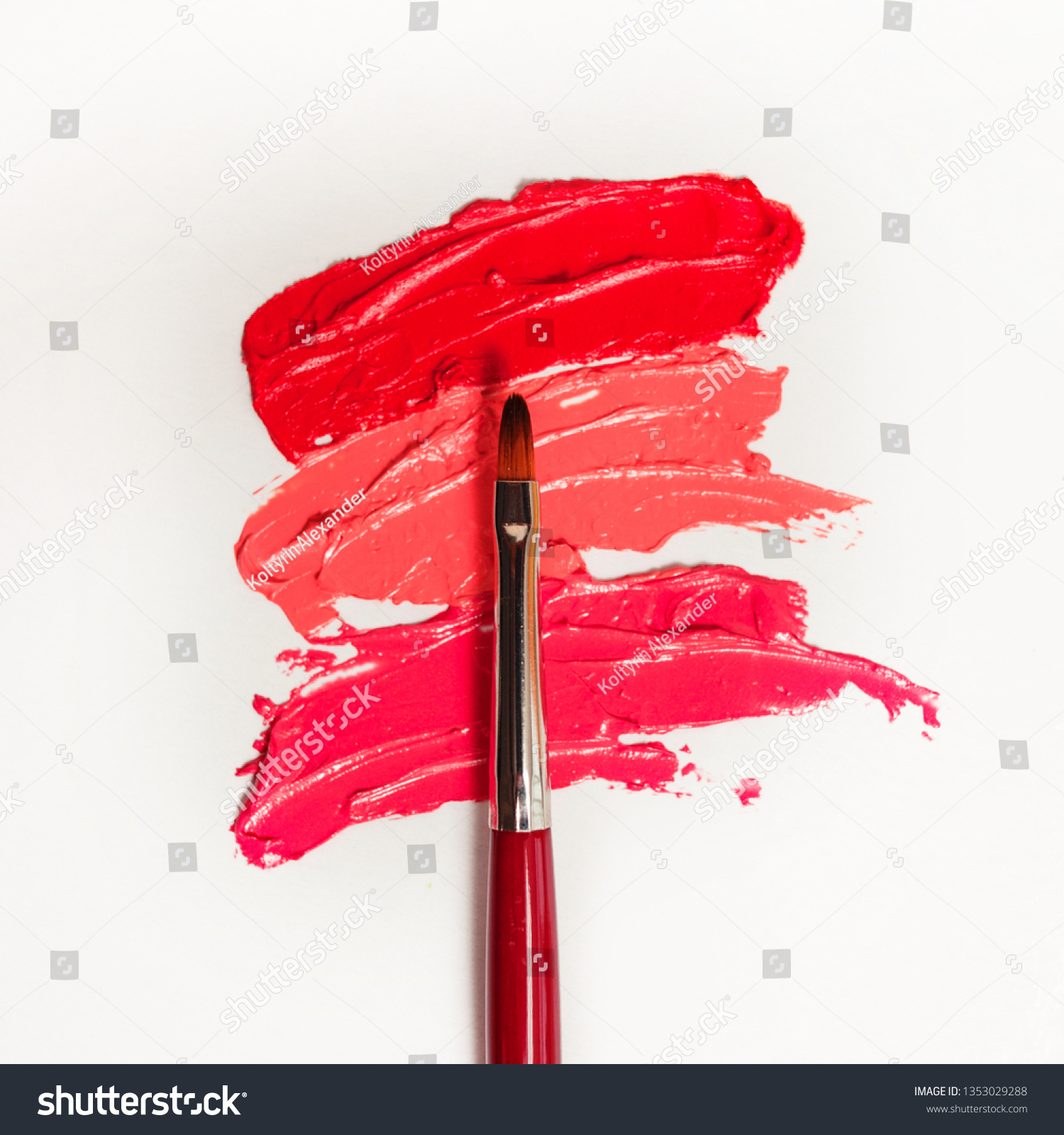 Lipstick and lip gloss, drops and strokes of different shades With brushes for application and shading, white background #1353029288
