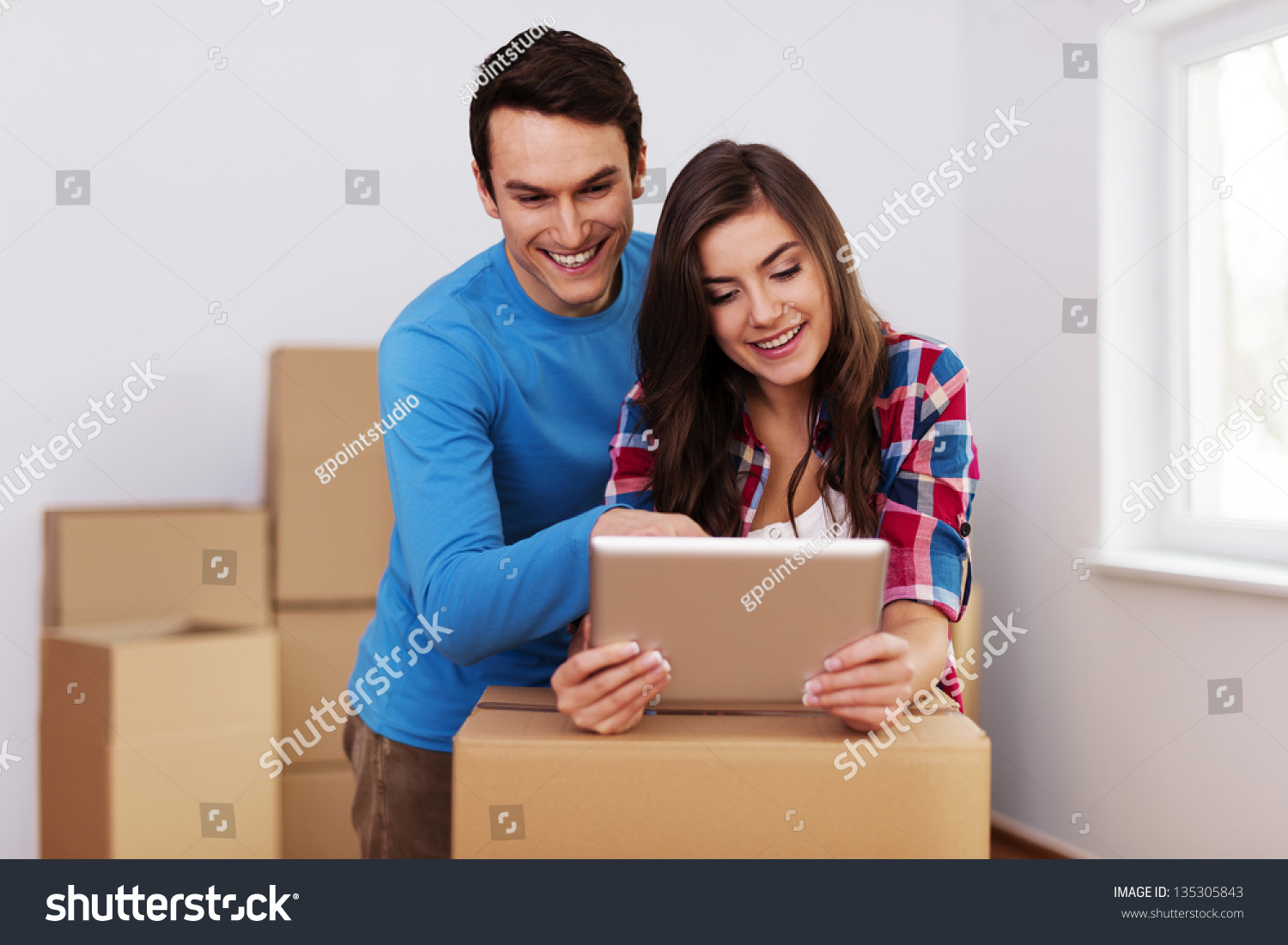 Young and loving couple arranging relocation in new home #135305843