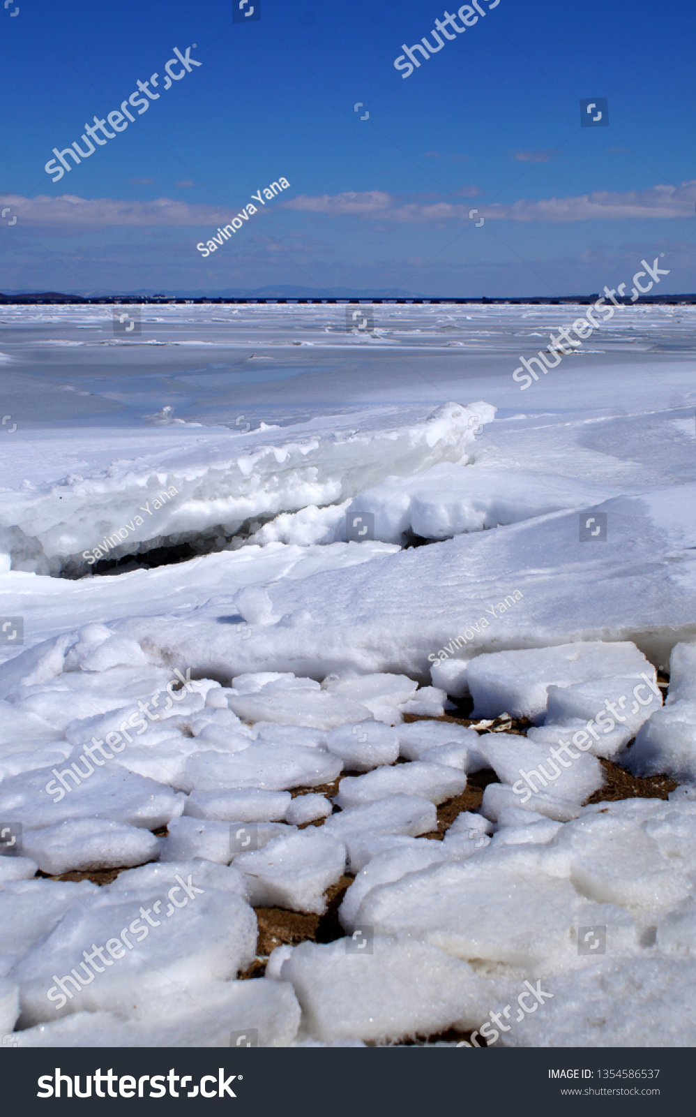 Ice drift on the sea against the blue sky                                #1354586537