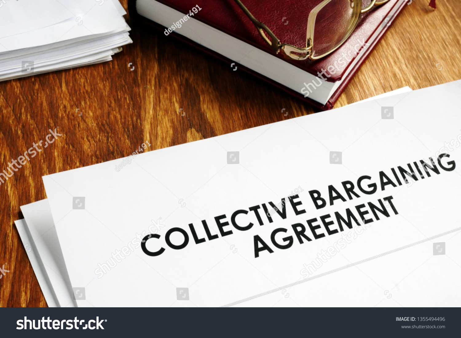 Collective bargaining agreement and note pad with glasses. #1355494496