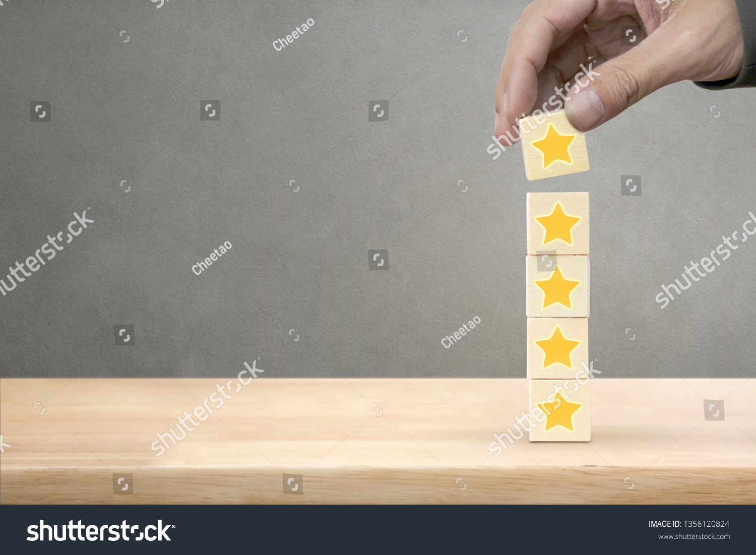 Hand arranging wood block stacking with icon five star symbol. Rating customer service satisfaction experience concept #1356120824