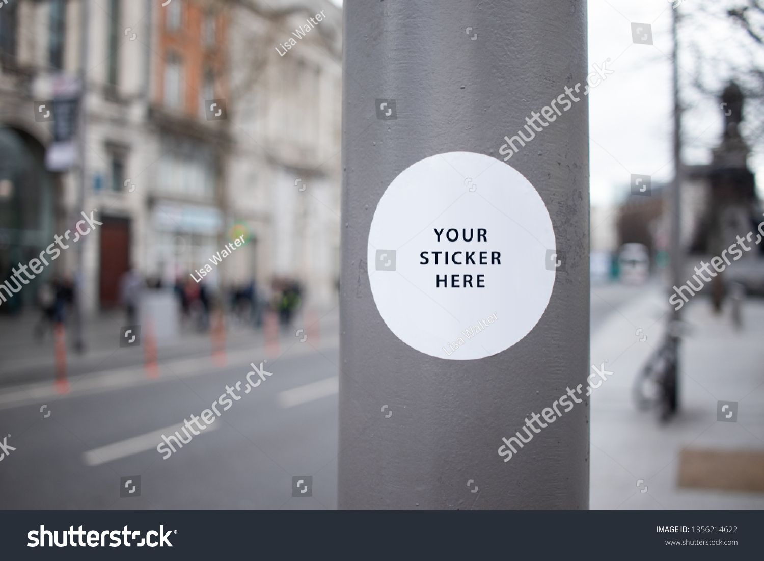 Sticker Mockup on a street lamp in a busy city street #1356214622