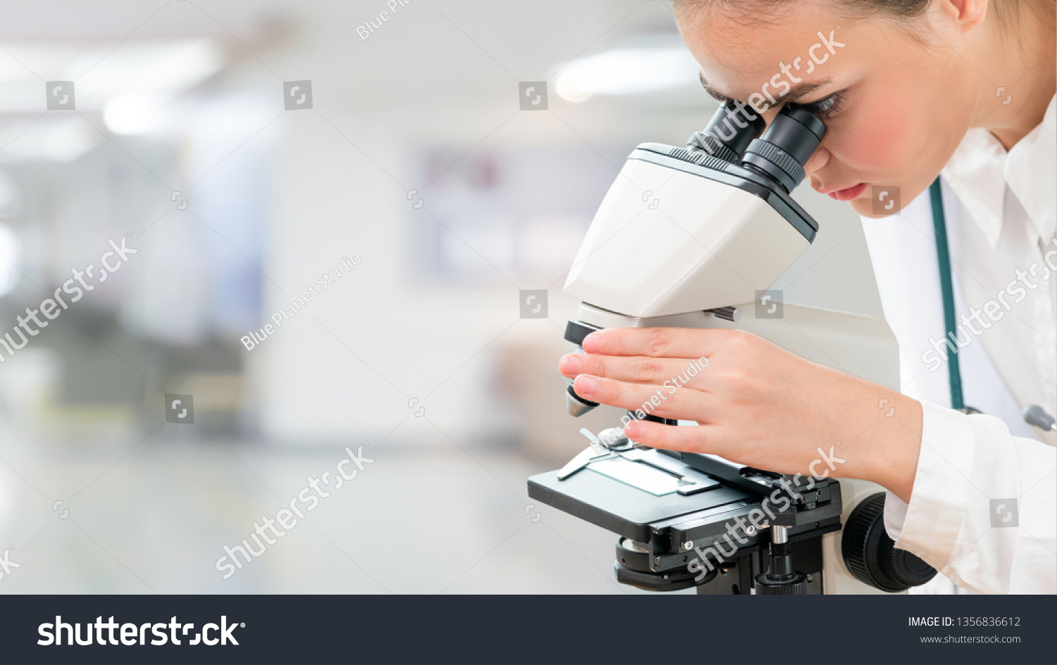 Scientist researcher using microscope in laboratory. Medical healthcare technology and pharmaceutical research and development concept. #1356836612