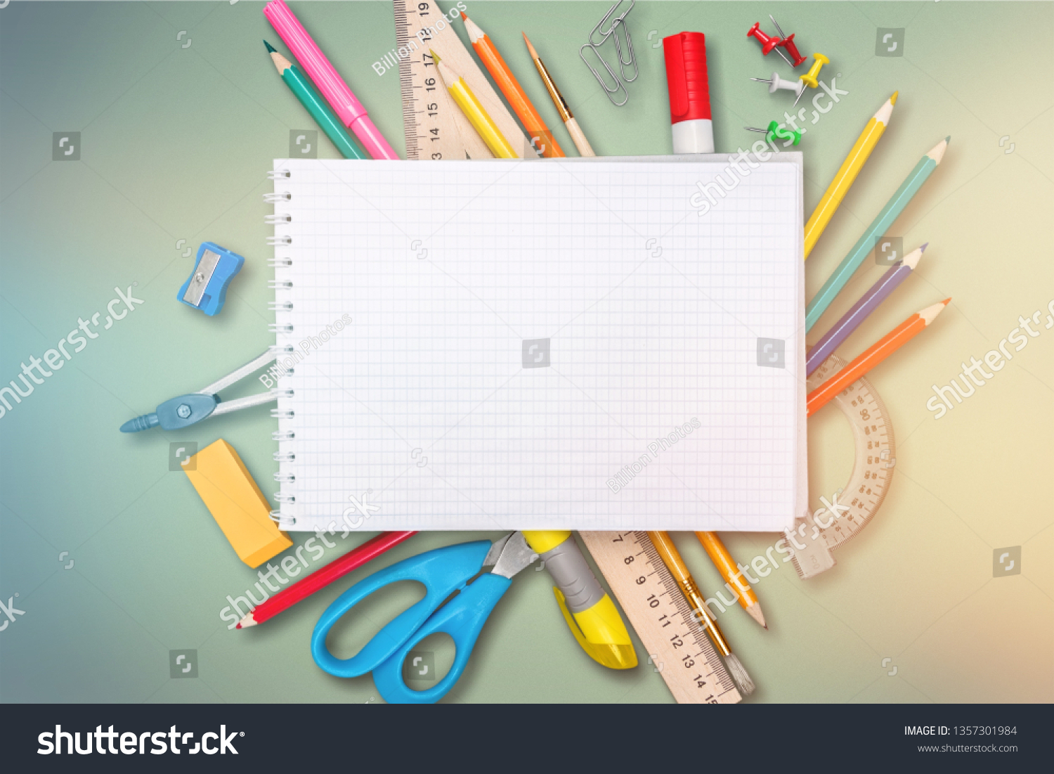 Colorful school supplies on wooden table background #1357301984