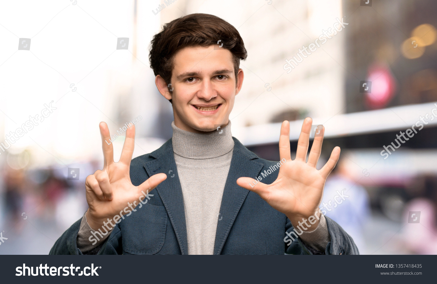Teenager man with turtleneck counting eight with fingers at outdoors #1357418435