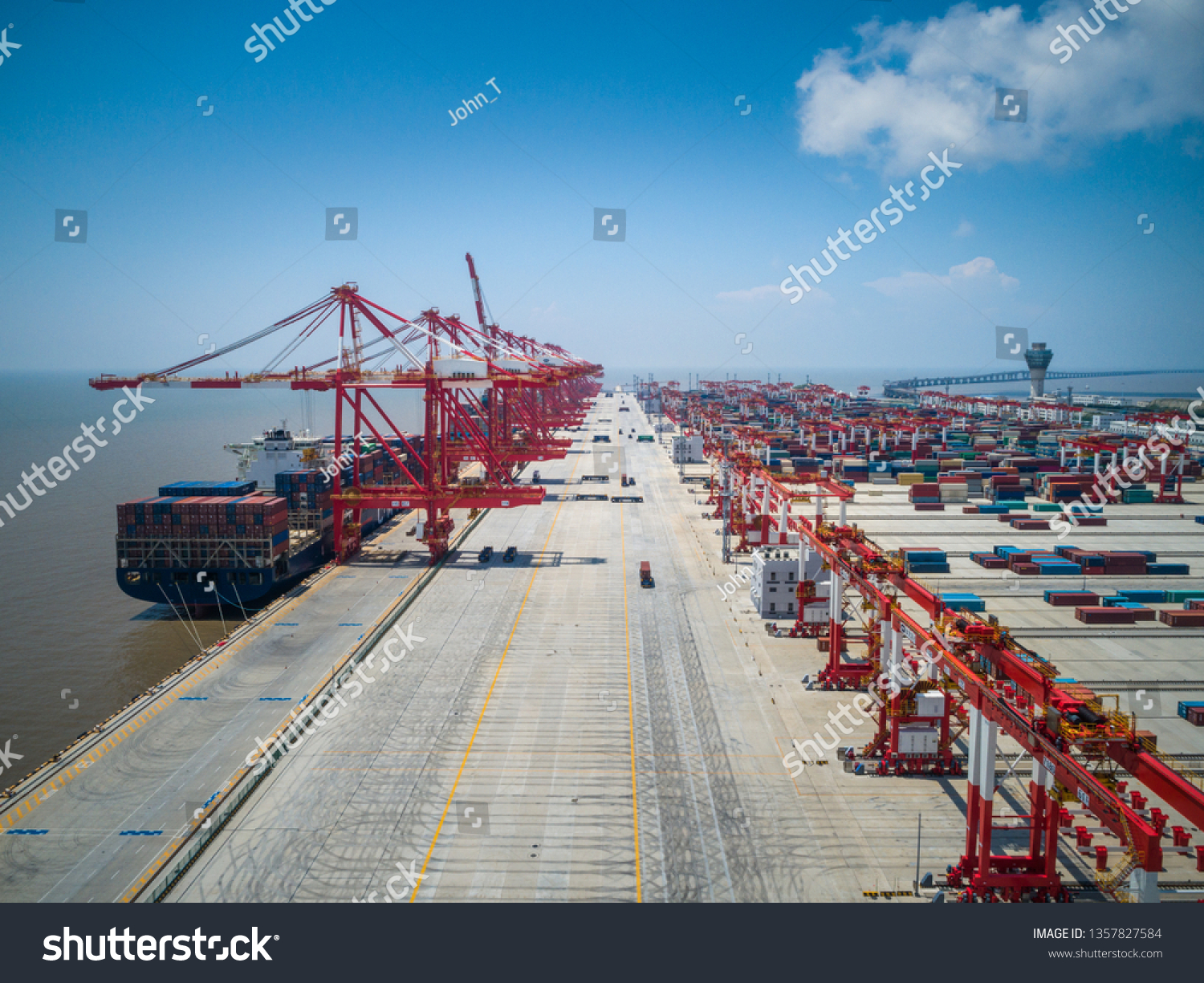 Container ship in export and import business and logistics. Shipping cargo to harbor by crane. Water transport International. Aerial view #1357827584