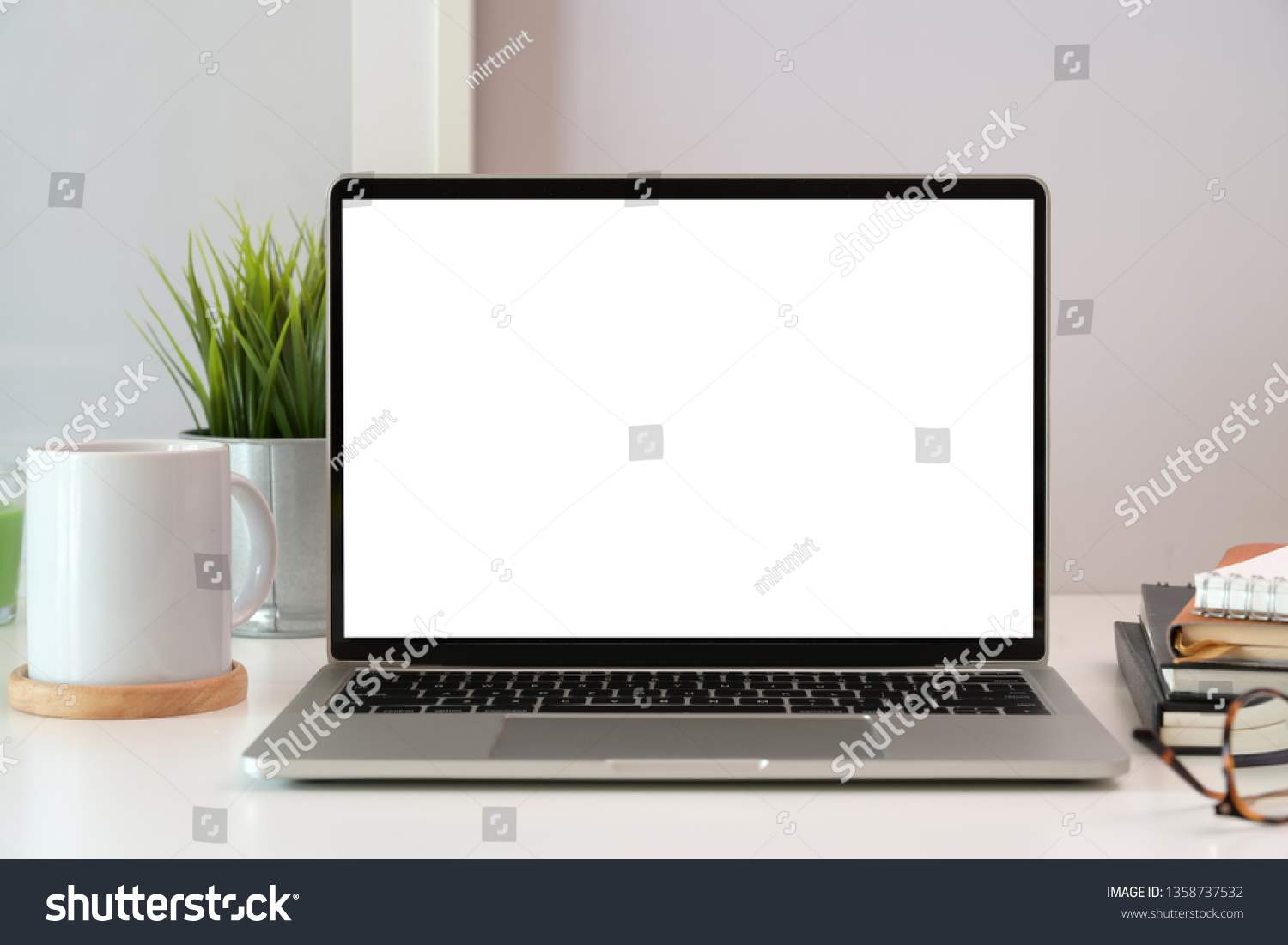 Laptop on white wooden business workspace desk #1358737532