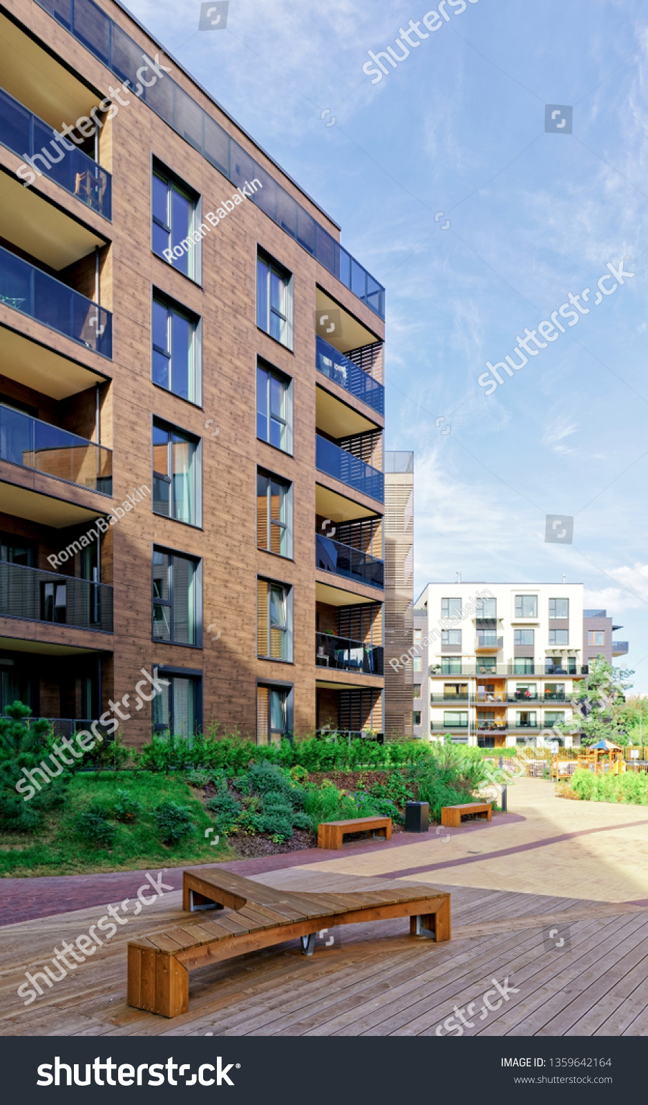 Benches at Modern architectural complex of apartment residential buildings. And outdoor facilities. #1359642164