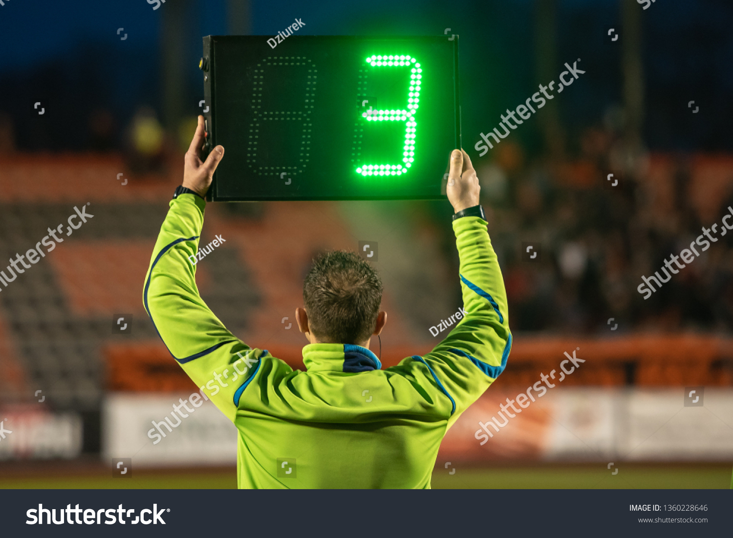 Technical referee shows 3 minutes added time during the football match. #1360228646