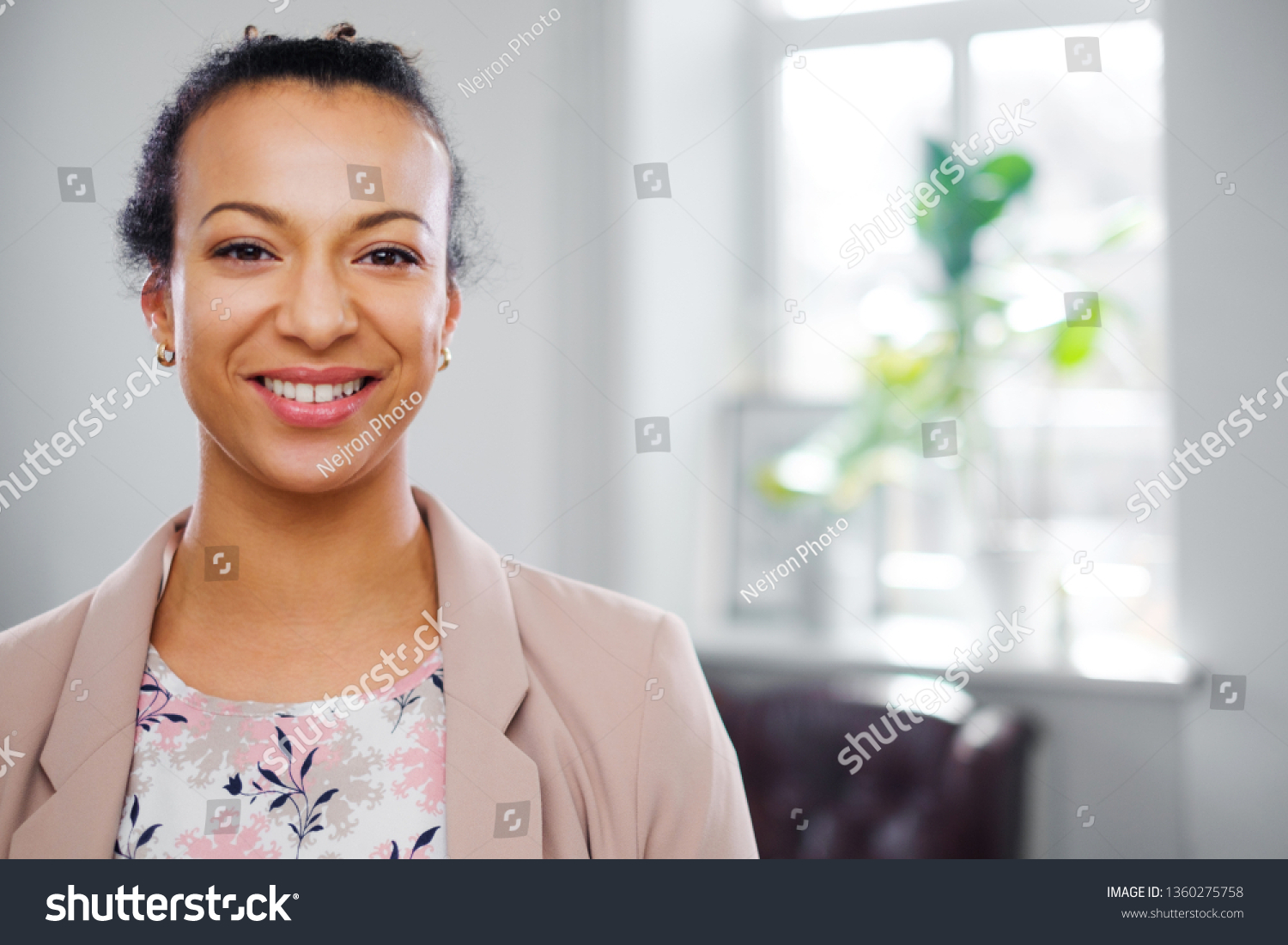 Young black woman face close-up #1360275758