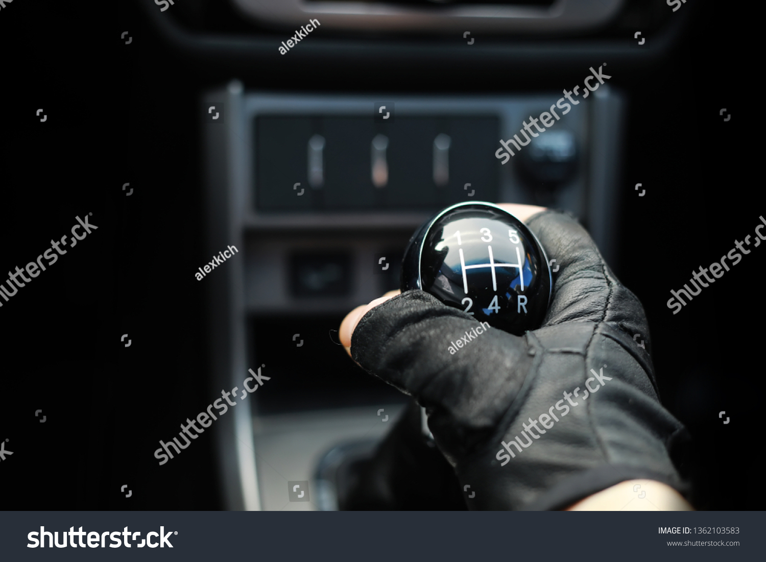 Gear lever. Manual Transmission. Hand on the gear shift in the car. #1362103583