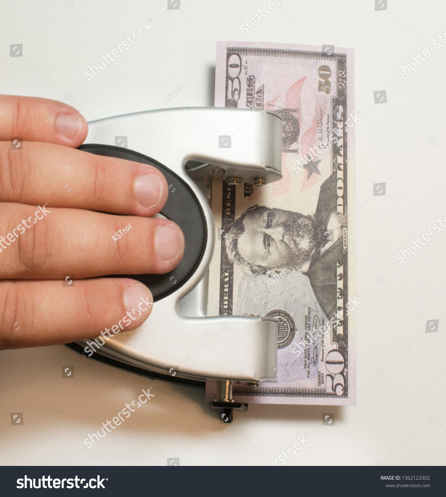 Close - up, the man s hand presses the hole in which the bill is. The close - up, the man s hand presses the hole in which the bill is invested 50 #1362123302