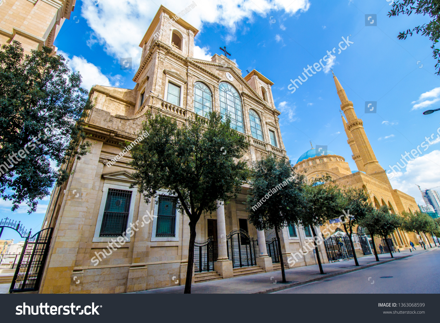 Church of Saint George Maronite and Mohammad Al-Amin Mosque coexist side by side in Downtown Beirut, Lebanon #1363068599