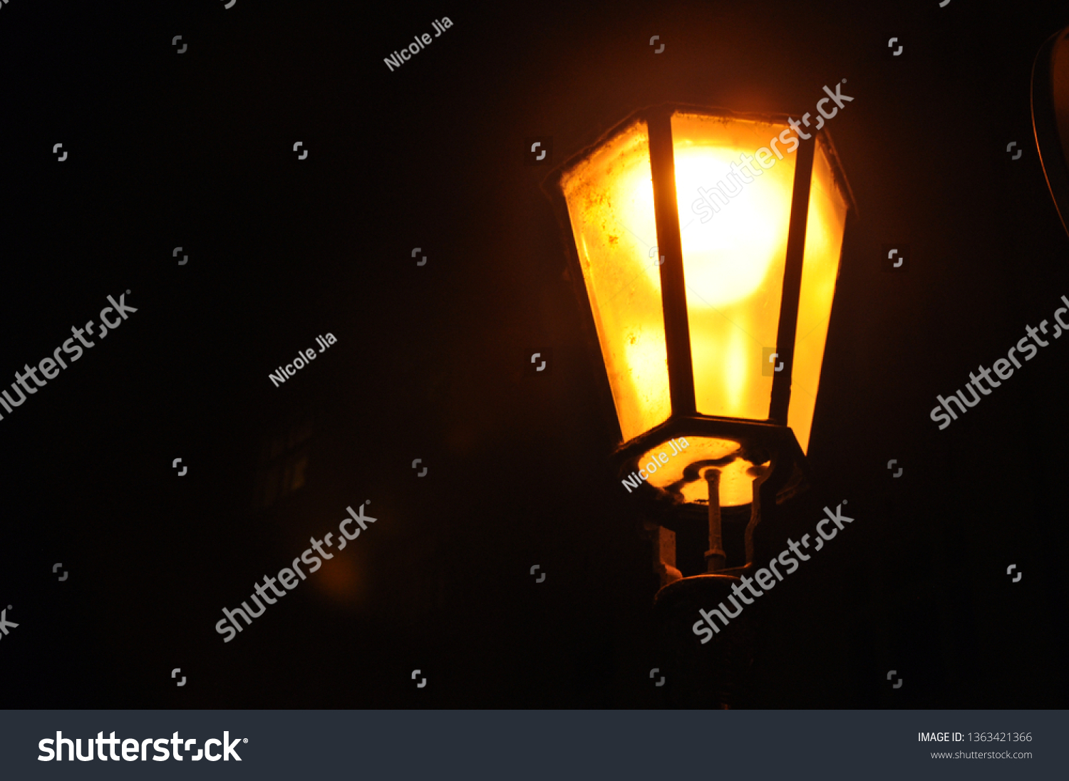 Amber glow from street lamp. Extremely aesthetic. Mysterious, foreshadowing and dangerous feeling but also warm, giving a sense of home and safety. Extreme contrast #1363421366