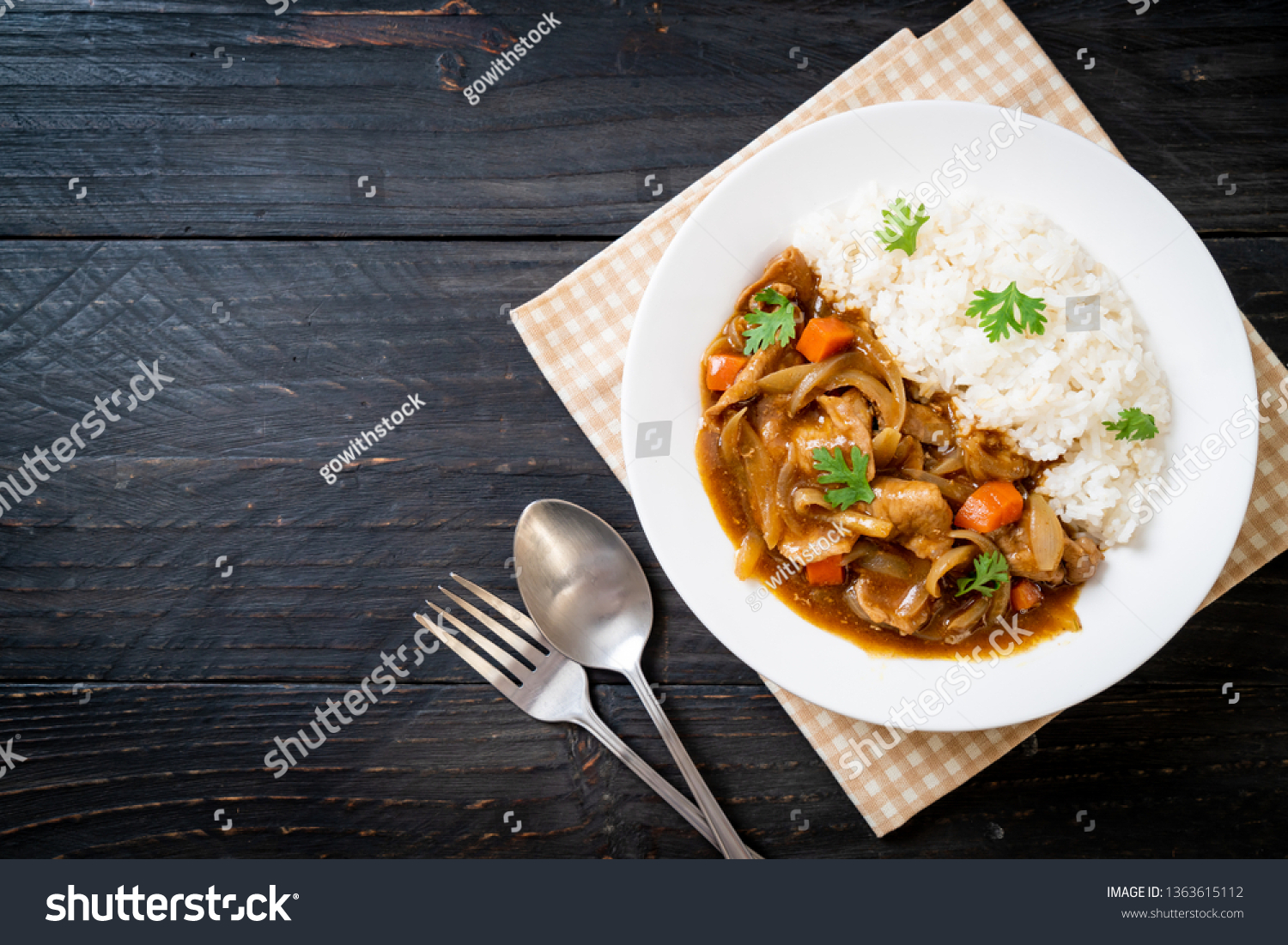 Japanese curry rice with sliced pork, carrot and onions - Asian style #1363615112