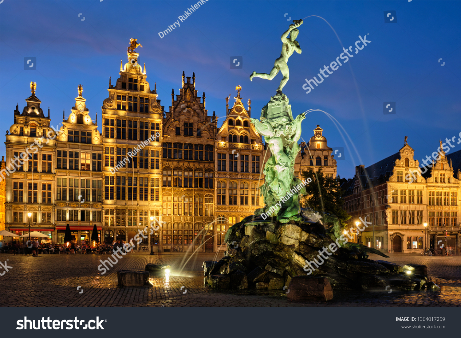 Antwerp famous Brabo statue and fountain on Grote Markt square illuminated at night and old houses. Antwerp, Belgium #1364017259