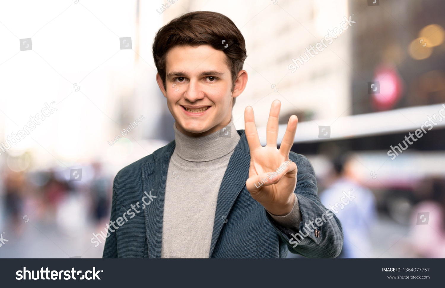 Teenager man with turtleneck happy and counting three with fingers at outdoors #1364077757