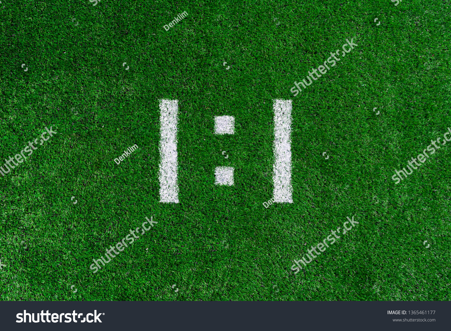 Football score 1:1.White numbers one and one are drawn on the green grass #1365461177