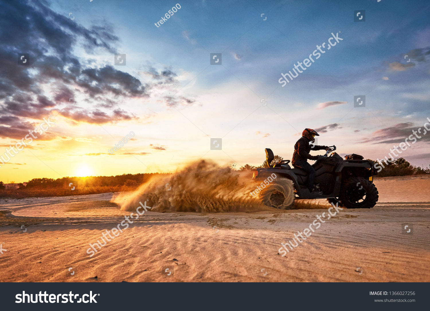 Racing powerful quad bike on the difficult sand in the summer. #1366027256