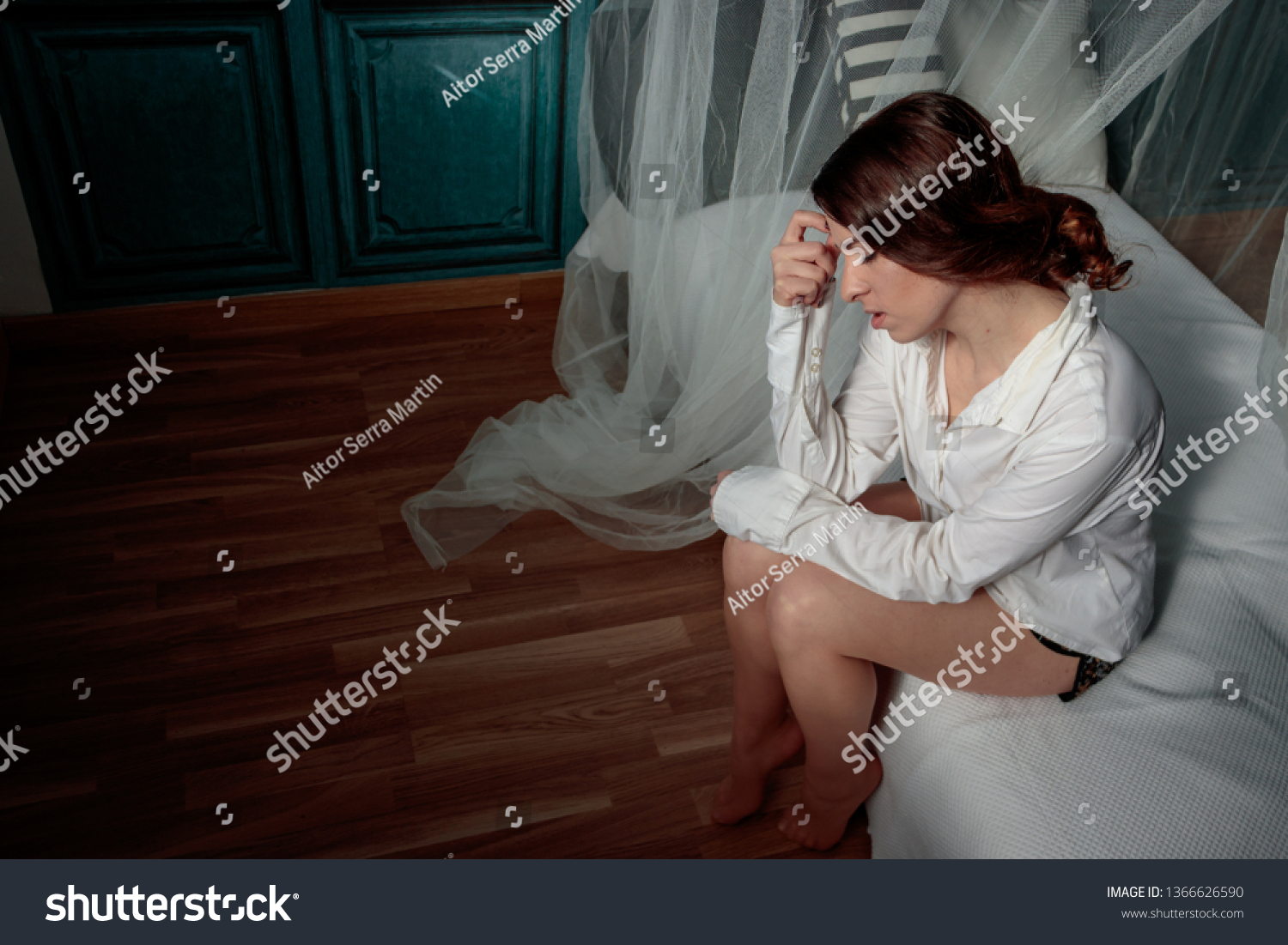 worried and thoughtful woman in bed #1366626590