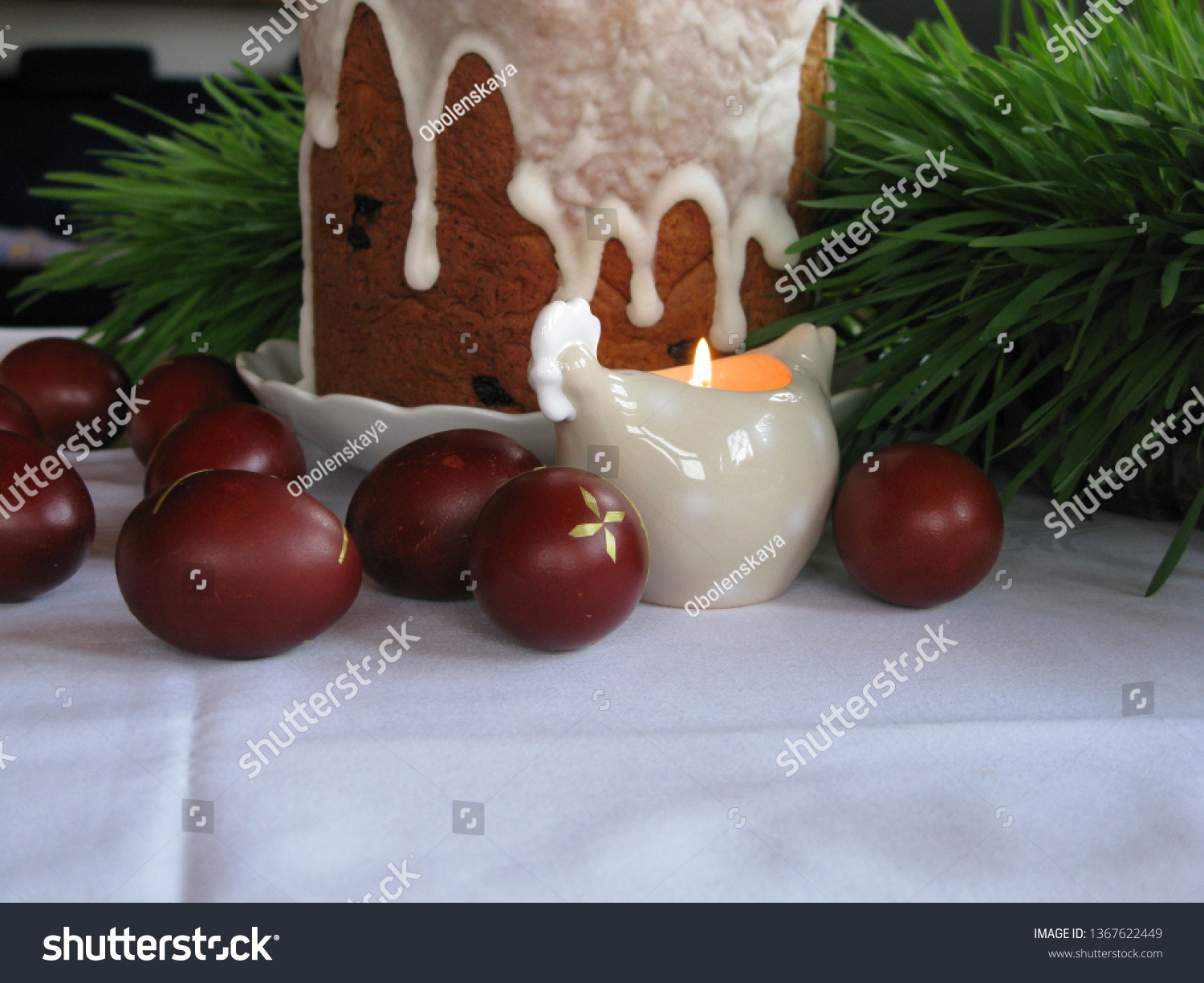 Easter symbols - Ester cake and eggs with oak grass and porcelain  figures of chicken. #1367622449