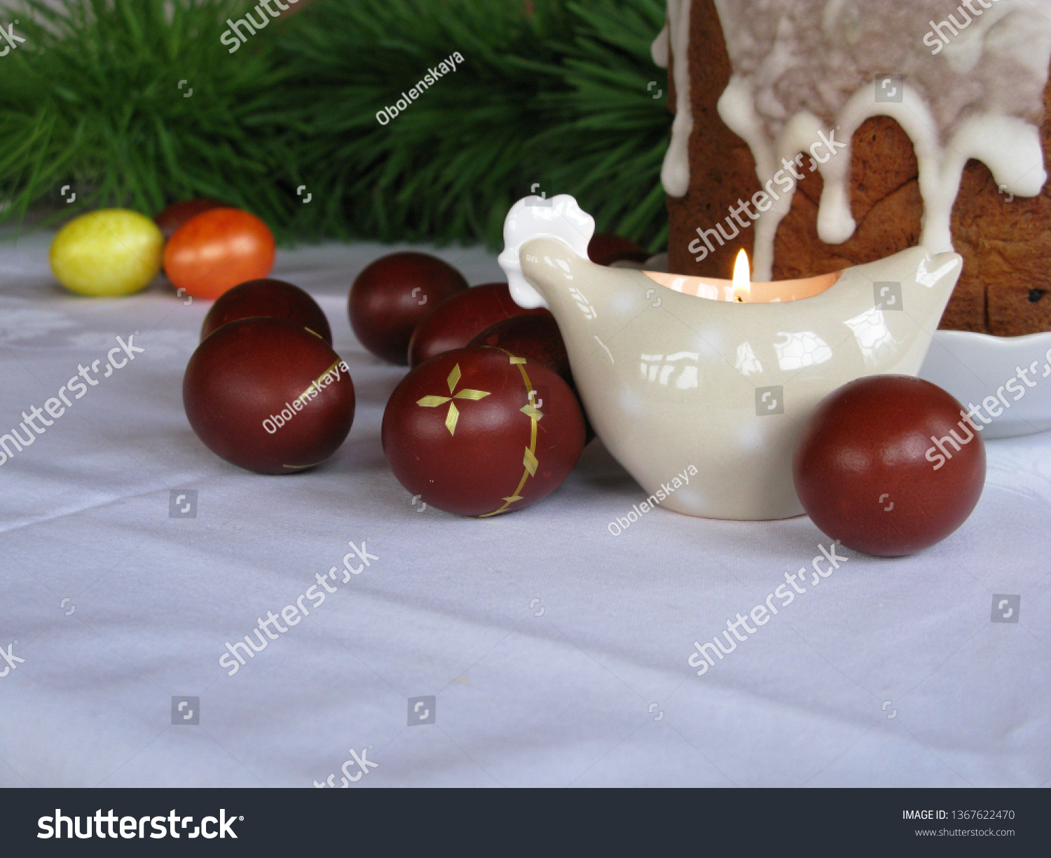 Easter symbols - Ester cake and eggs with oak grass and porcelain  figures of chicken. #1367622470