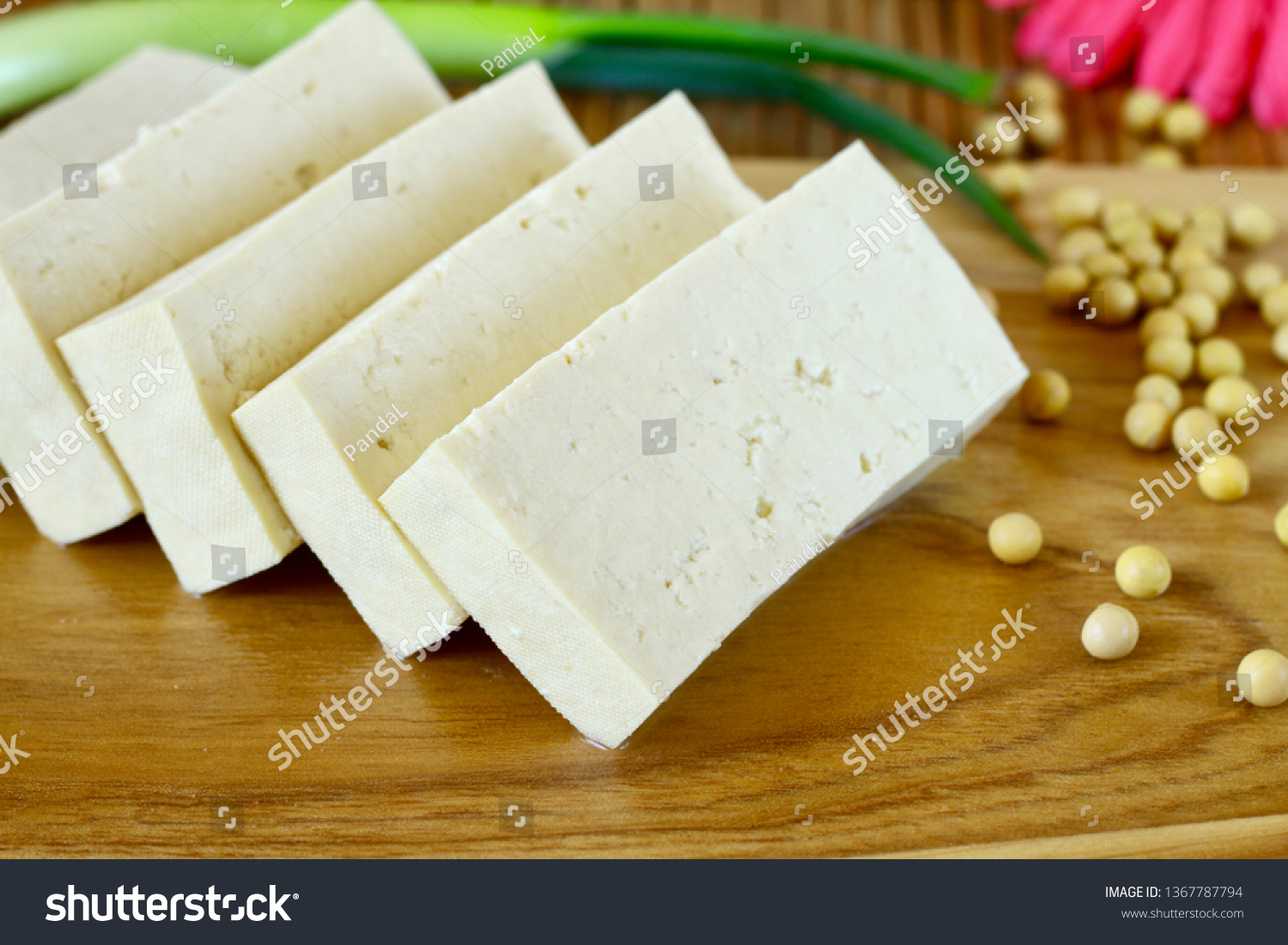 Sliced tofu on wood cutting board #1367787794