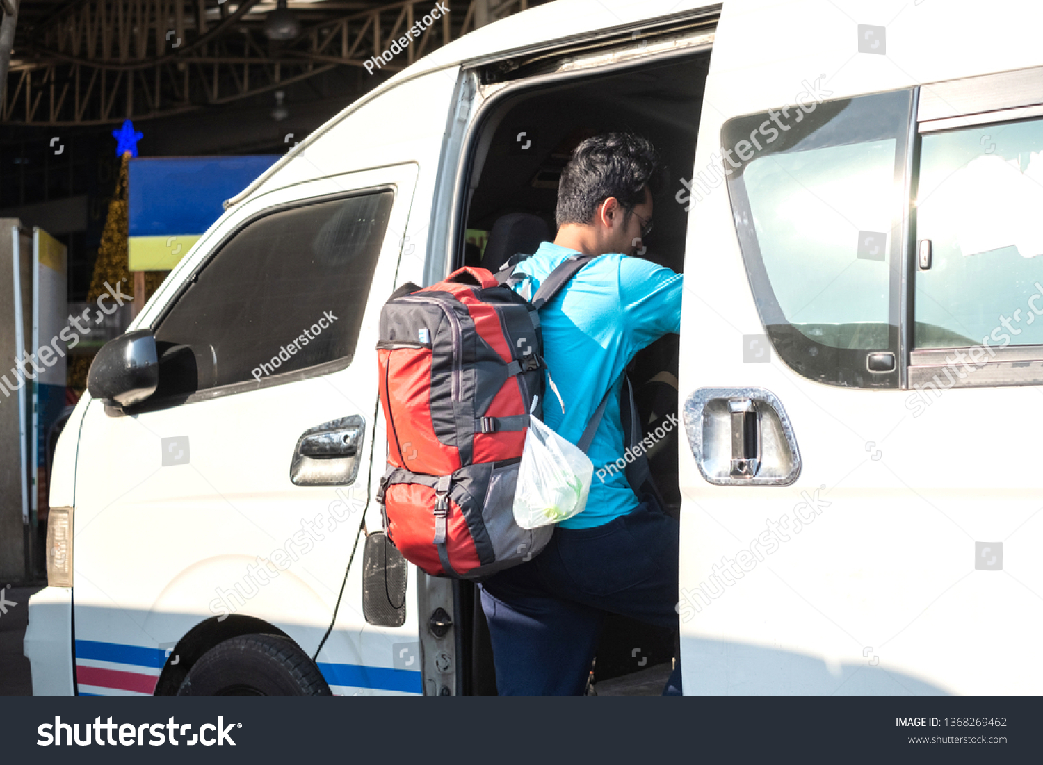 Backpack traveller travel using public van or mini bus in Thailand. #1368269462