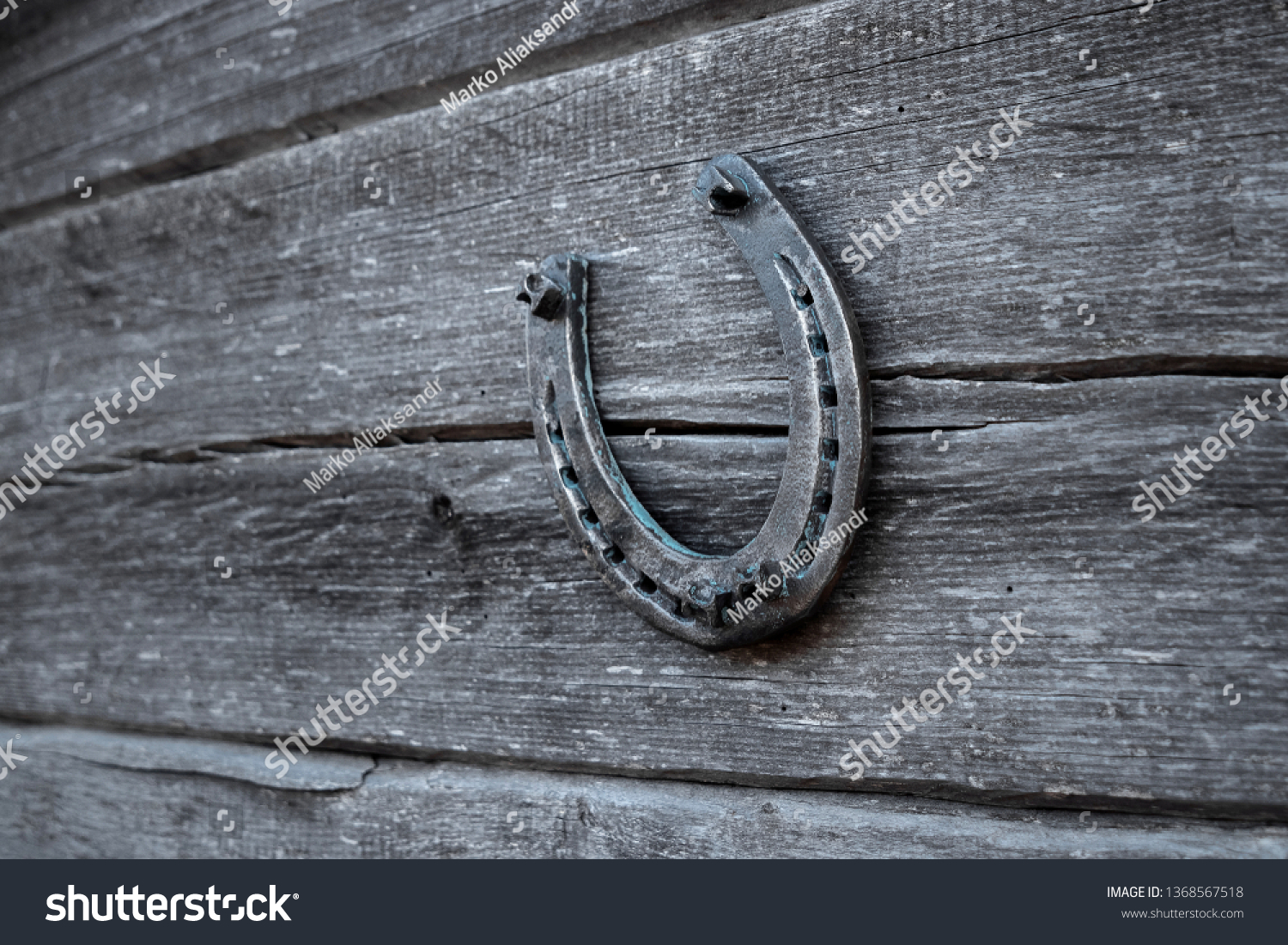 Old horseshoe on an old wooden board. The concept of luck, luck, luck. #1368567518