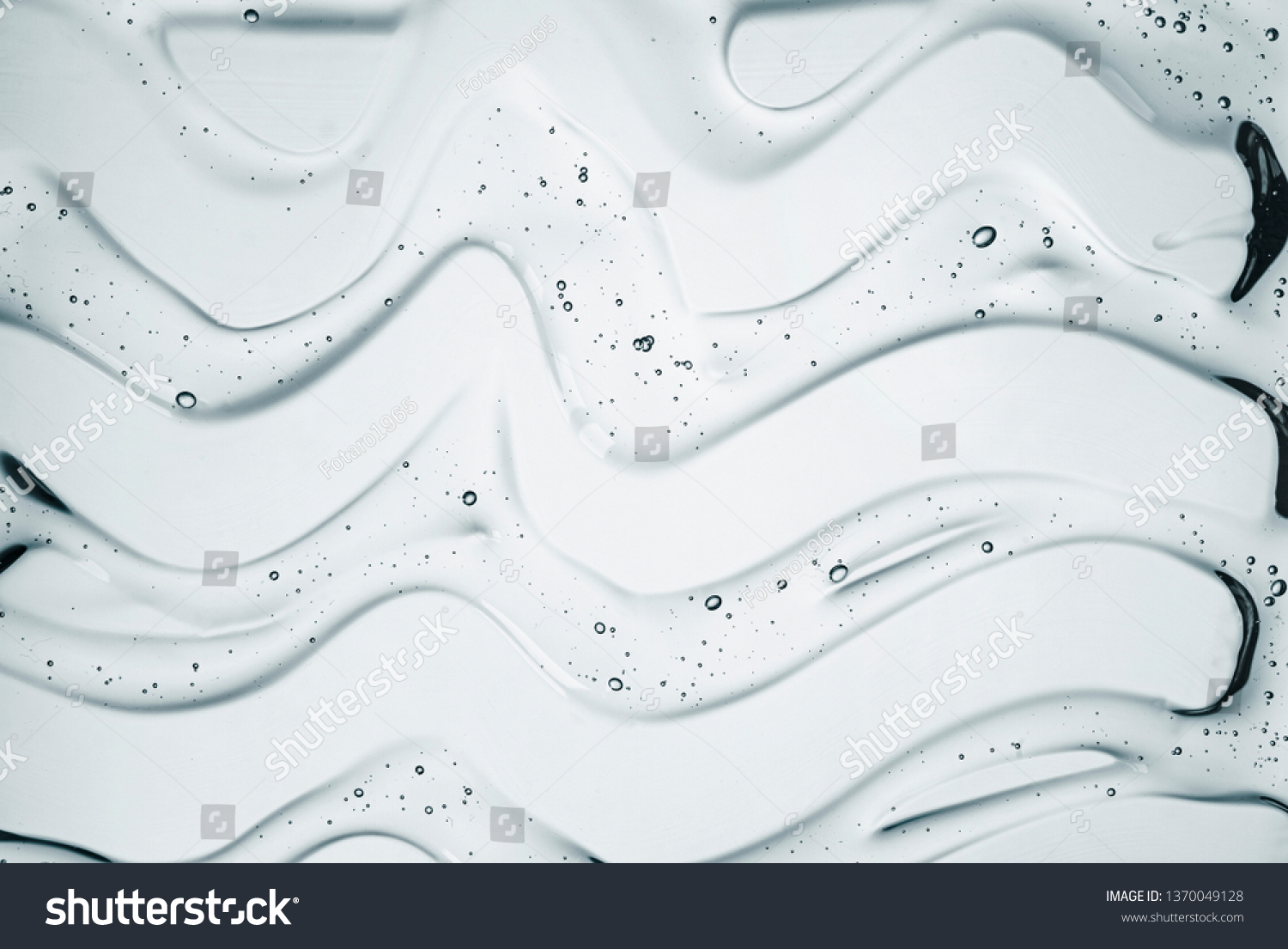Cream gel gray blue transparent cosmetic sample texture with bubbles isolated on white background #1370049128
