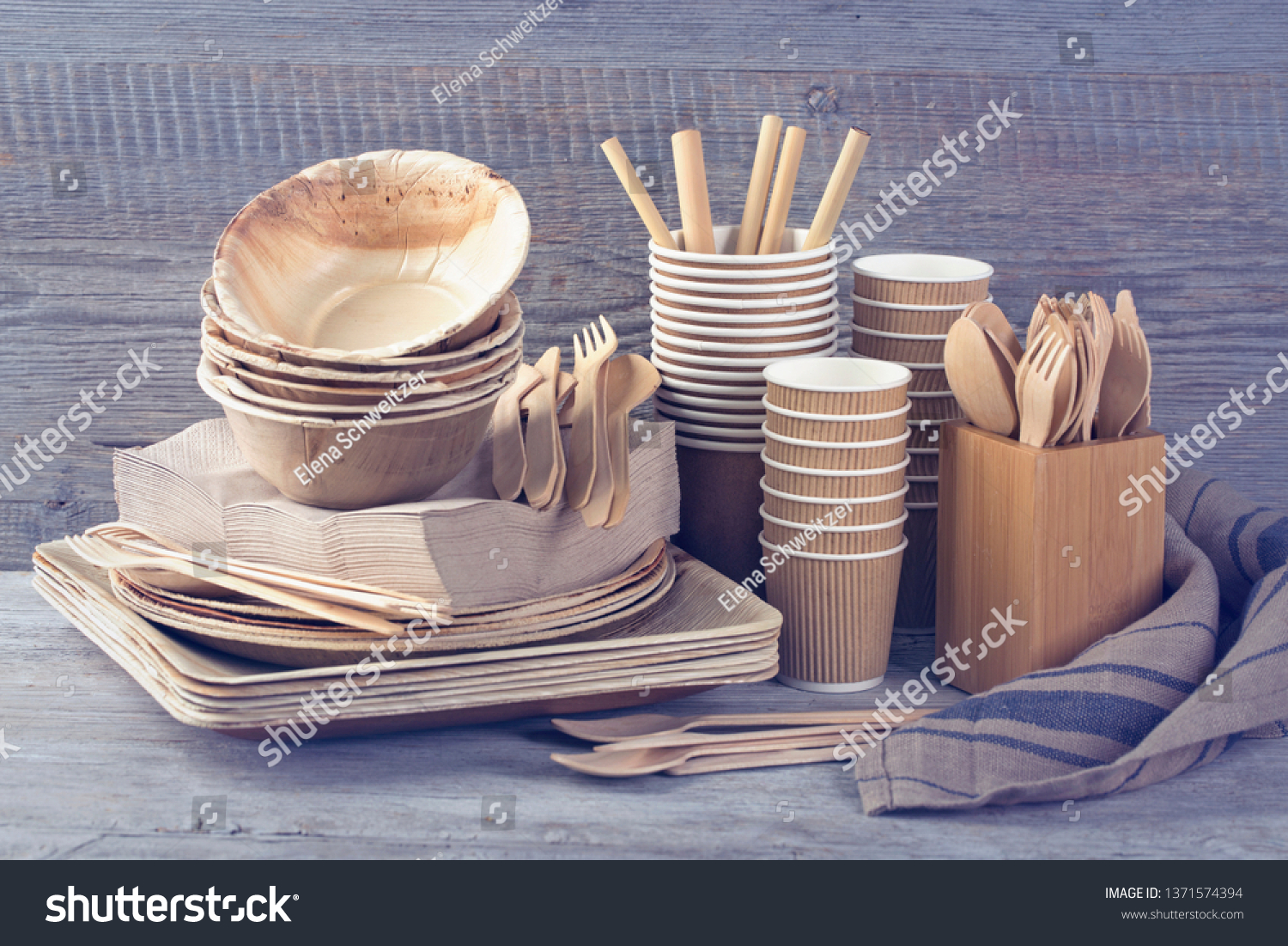 Eco friendly disposable tableware on a grey background #1371574394
